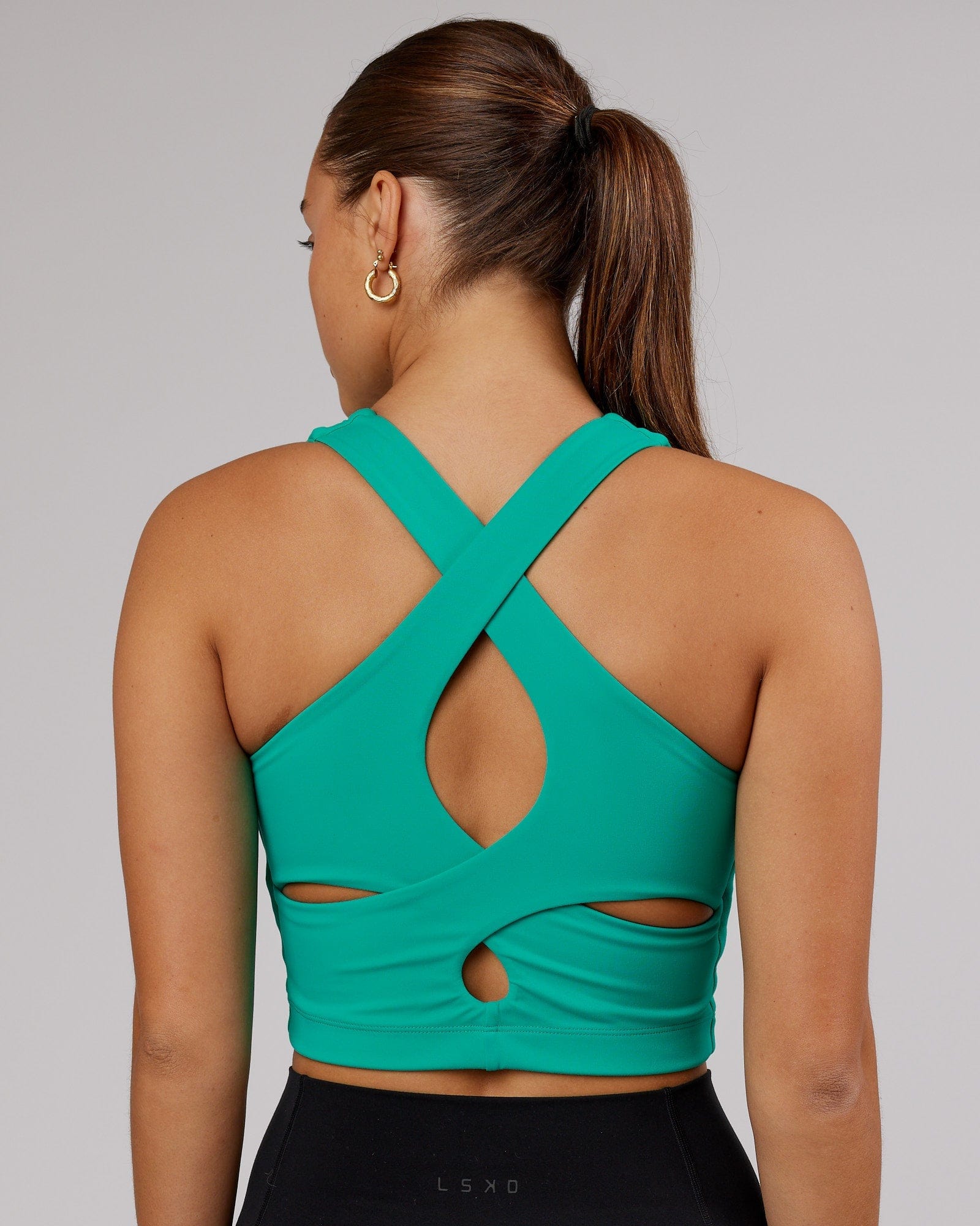 Model wearing Status Shelf Bra Active Tank - Hyper Teal