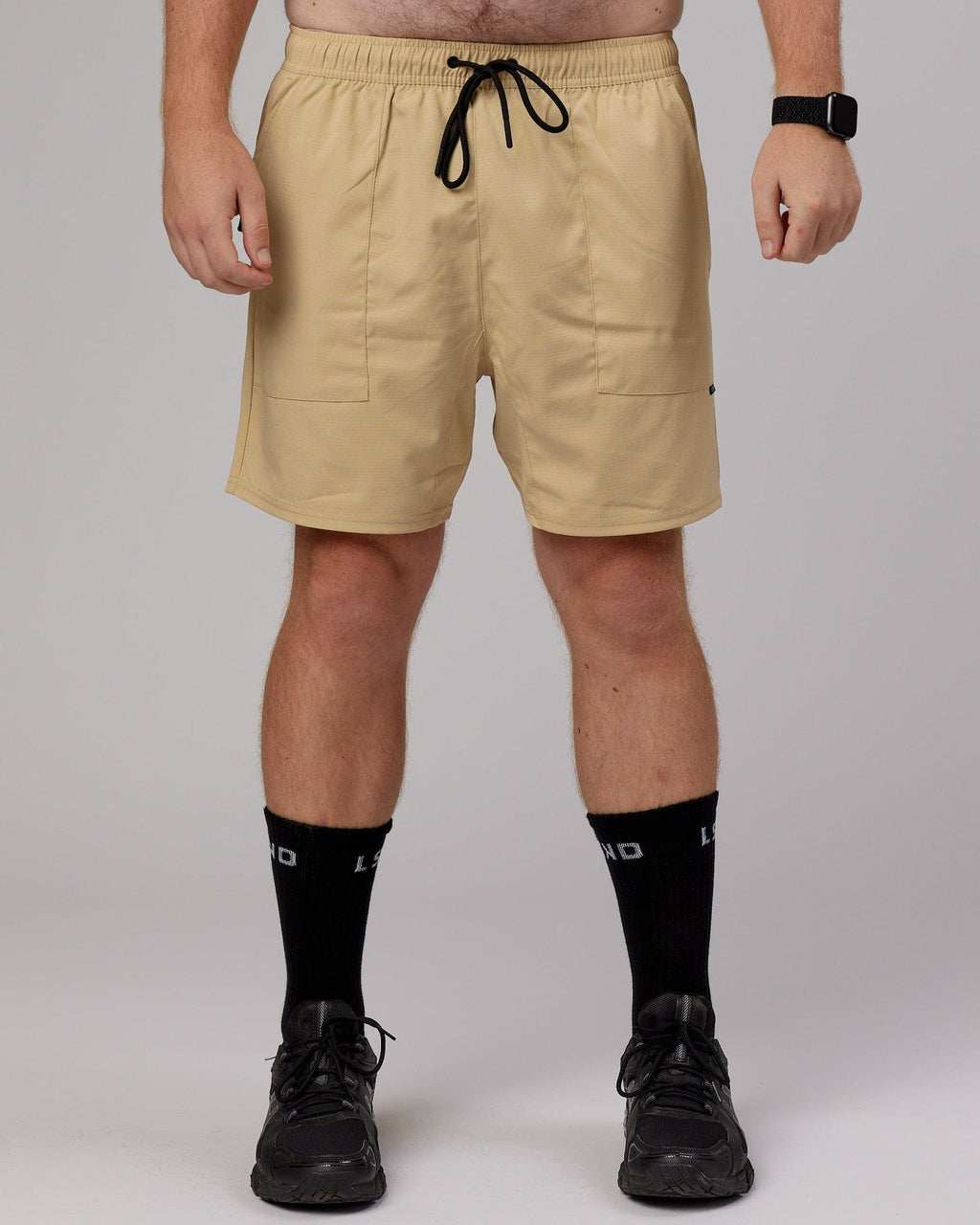 Model wearing Street Tech Short - Pale Khaki