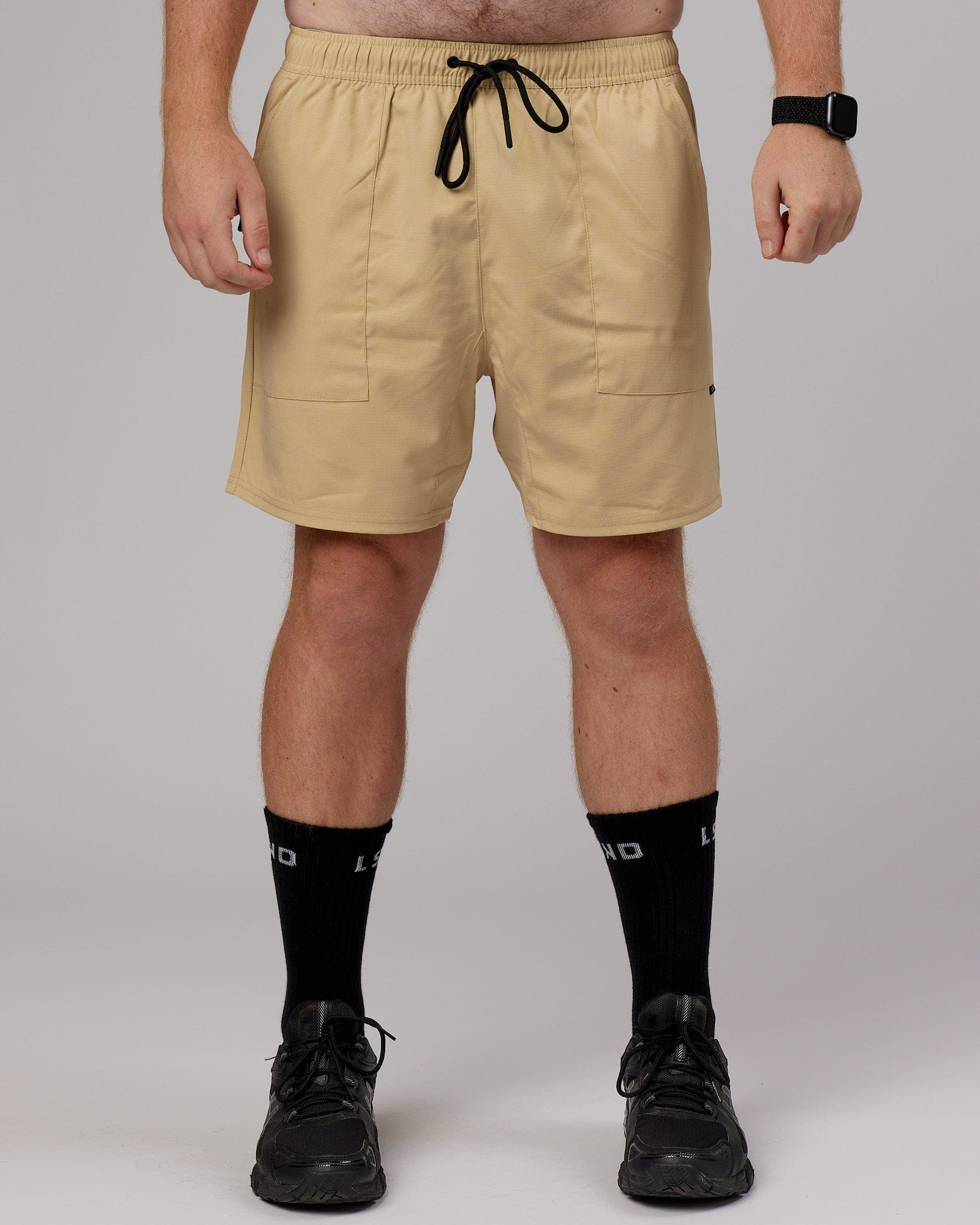 Model wearing Street Tech Short - Pale Khaki
