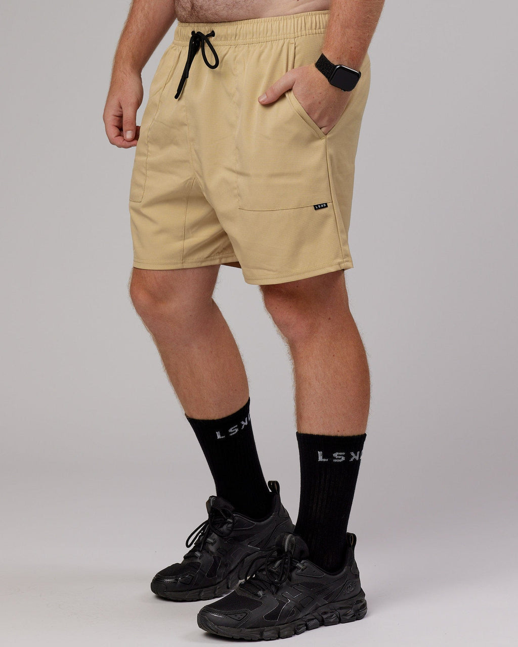 Model wearing Street Tech Short - Pale Khaki