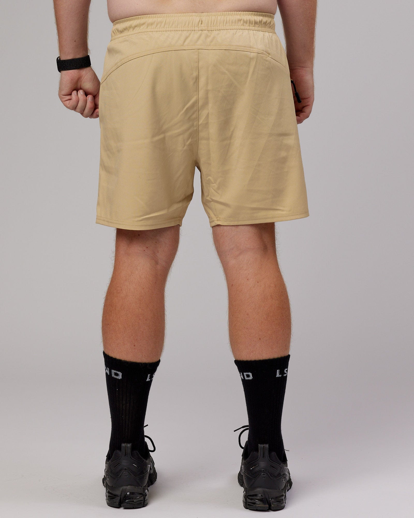 Model wearing Street Tech Short - Pale Khaki