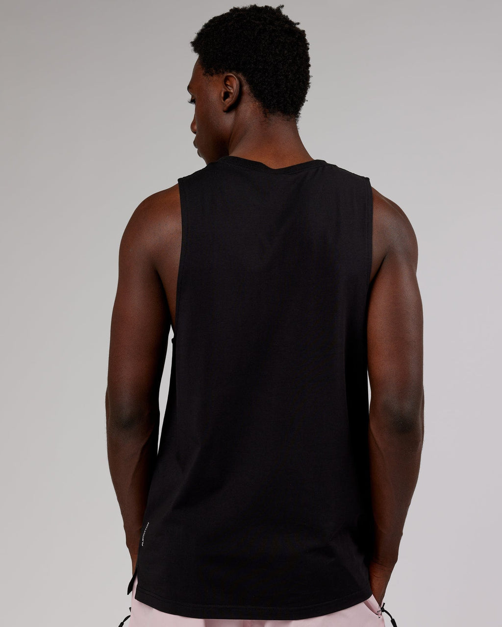 Model wearing Strength FLXCotton Training Fit Tank - Black-Pink