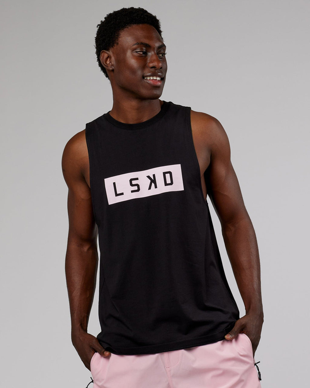 Model wearing Strength FLXCotton Training Fit Tank - Black-Pink