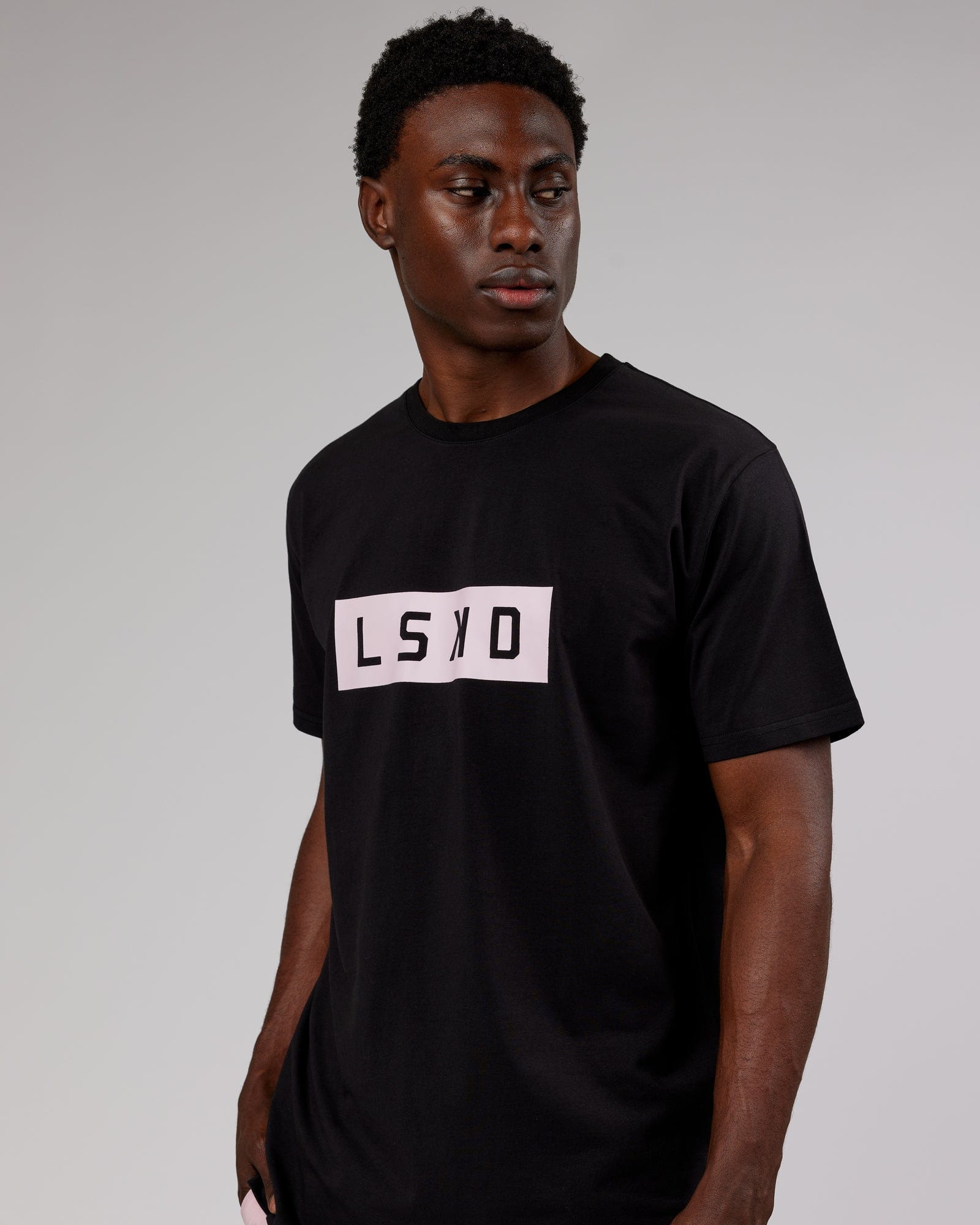 Model wearing Strength FLXCotton Tee - Black-Pink