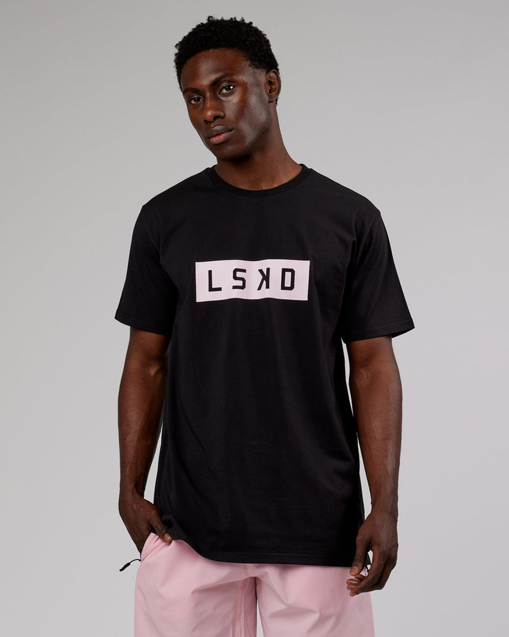 Model wearing Strength FLXCotton Tee - Black-Pink
