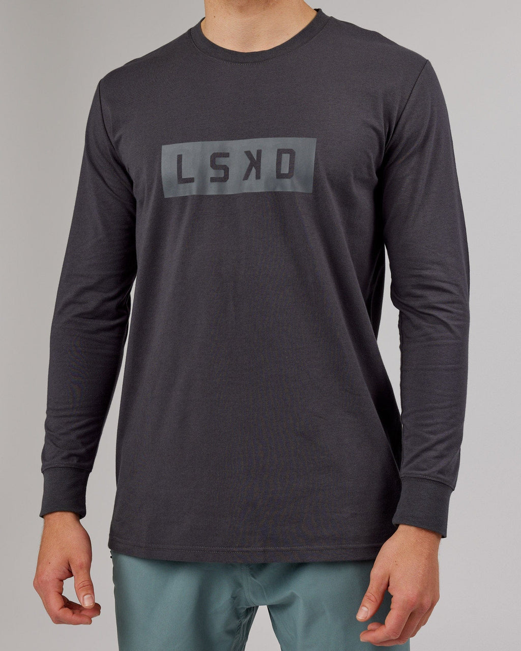 Model wearing Strength FLXDRY Performance LS Tee - Asphalt
