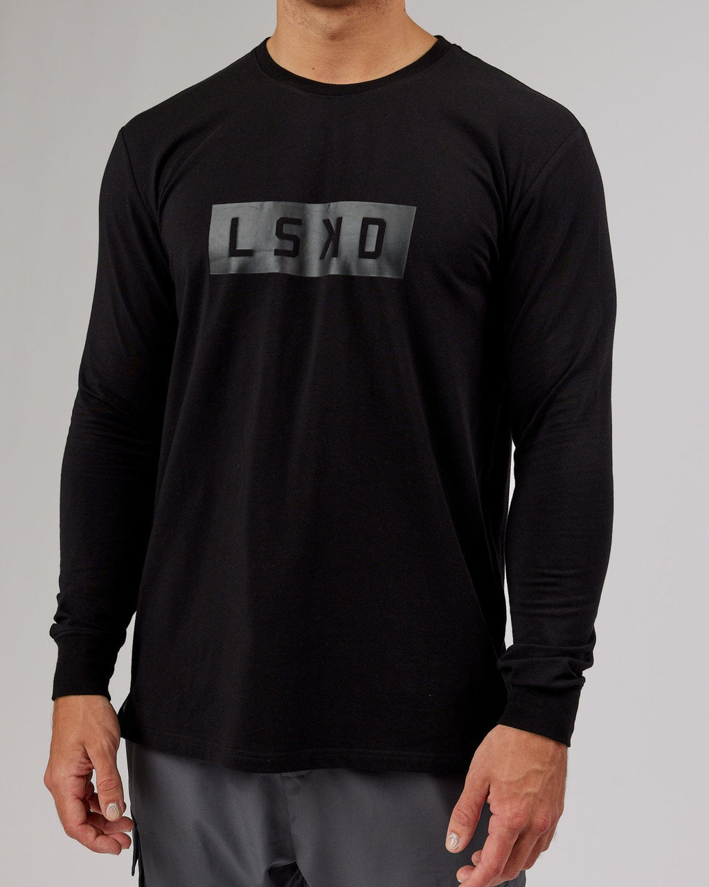 Model wearing Strength FLXDRY Performance LS Tee - Black