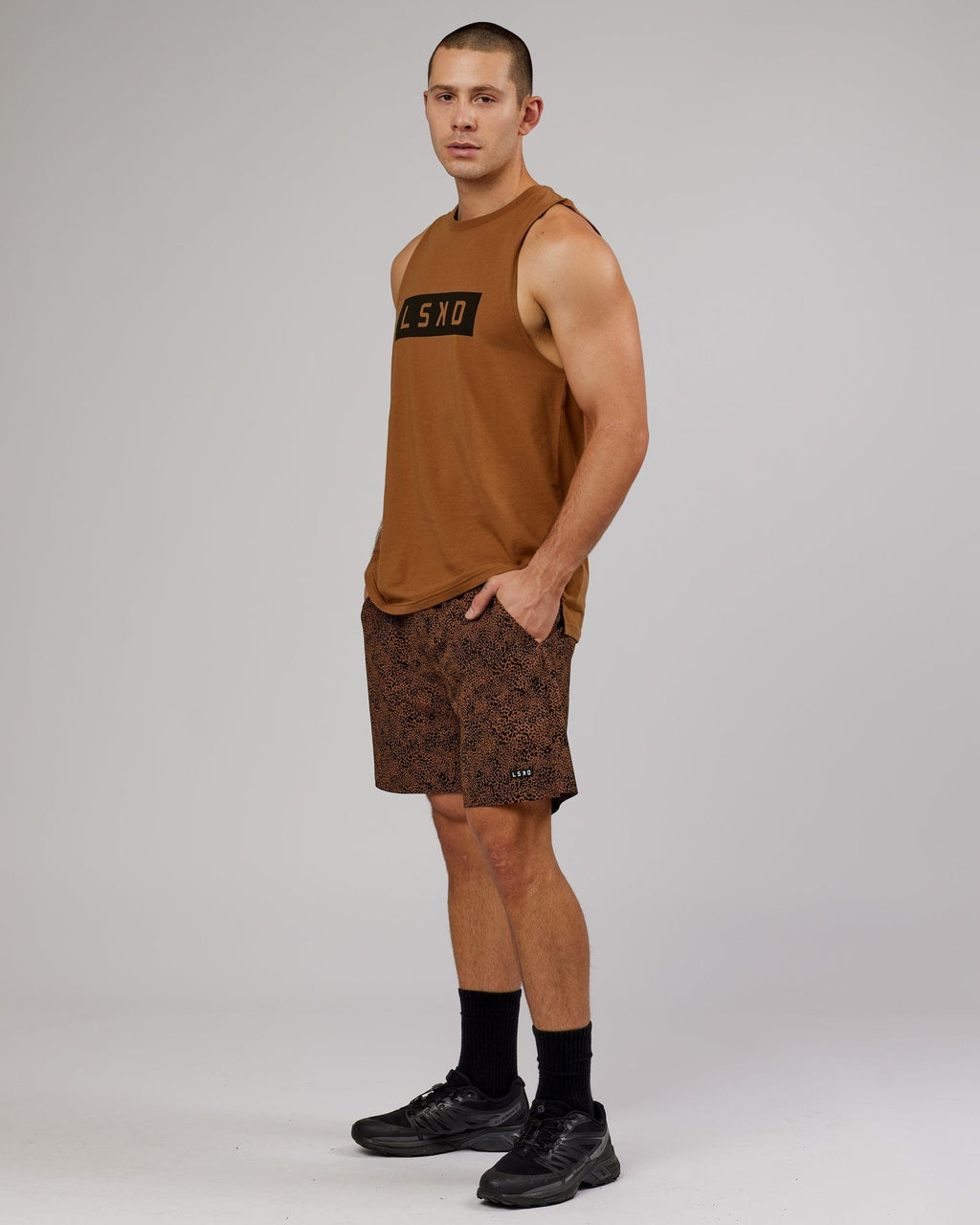 Model wearing Strength FLXDRY Training Fit Performance Tank - Camel