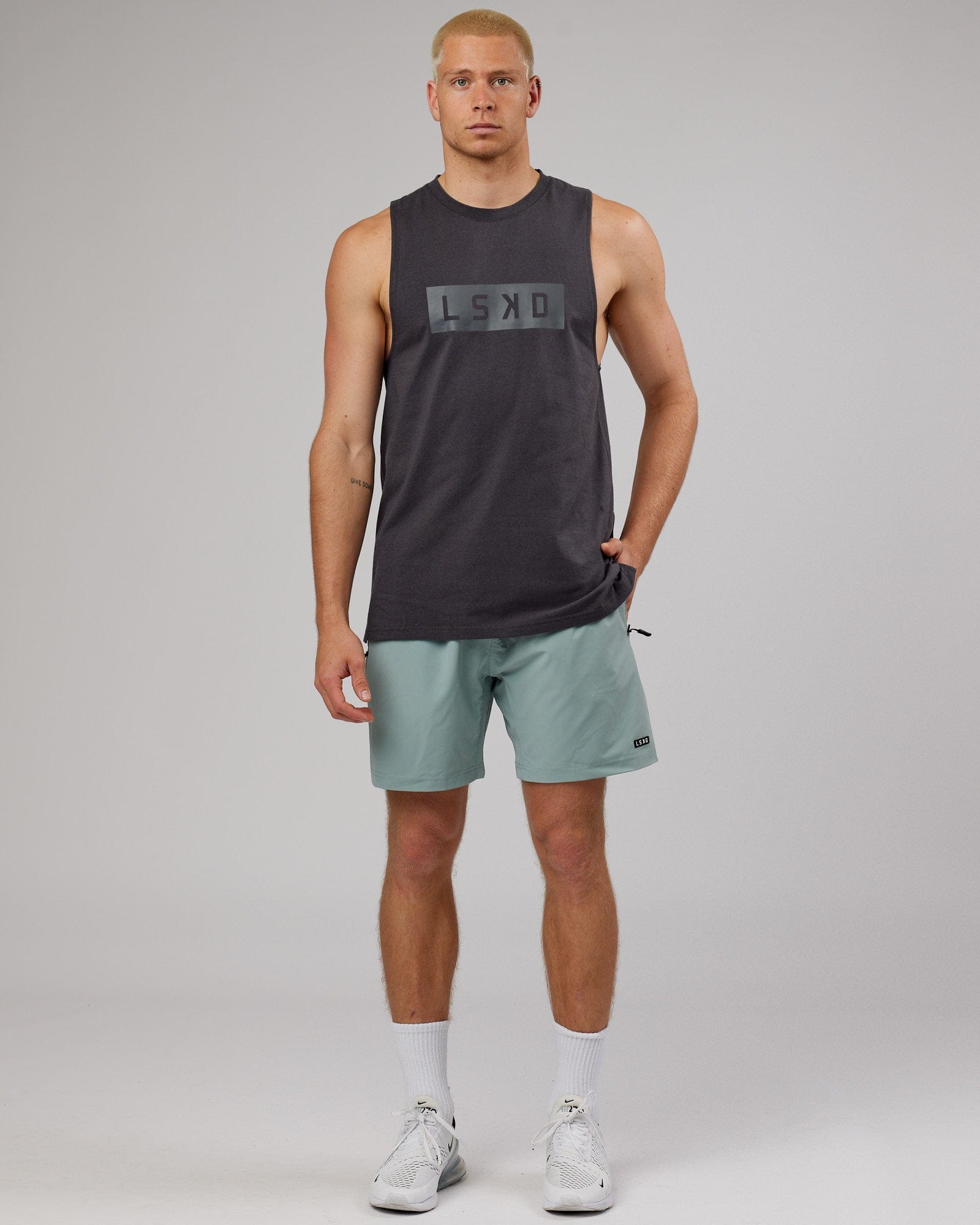 Model wearing Strength FLXDRY Training Fit Performance Tank - Asphalt