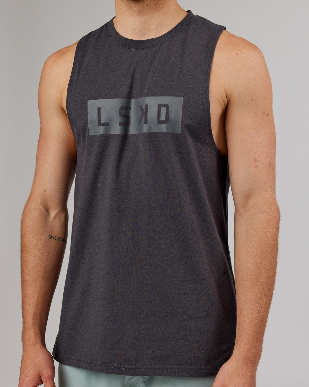 Model wearing Strength FLXDRY Training Fit Performance Tank - Asphalt