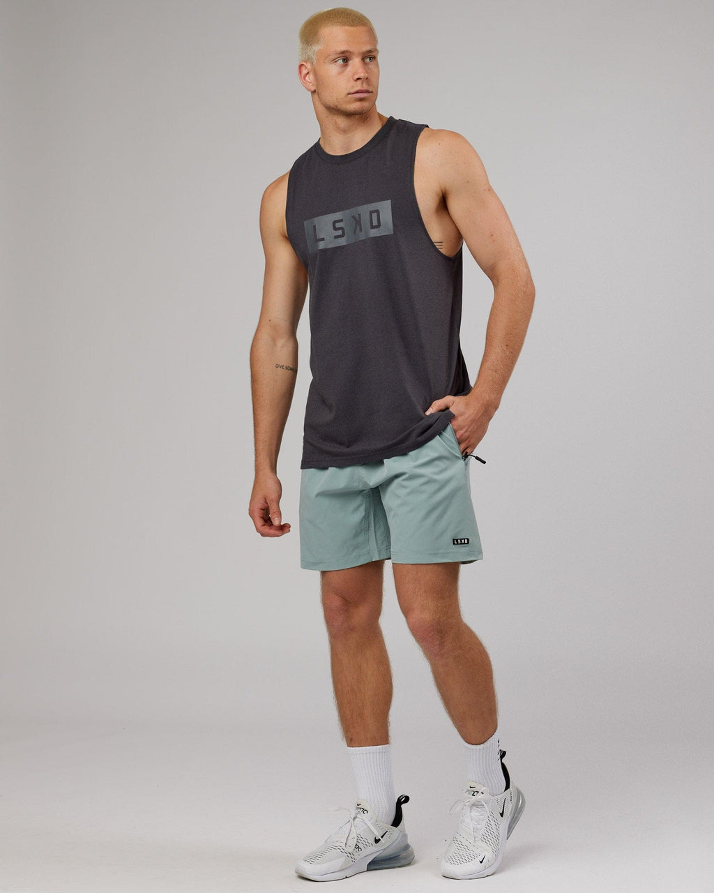 Model wearing Strength FLXDRY Training Fit Performance Tank - Asphalt