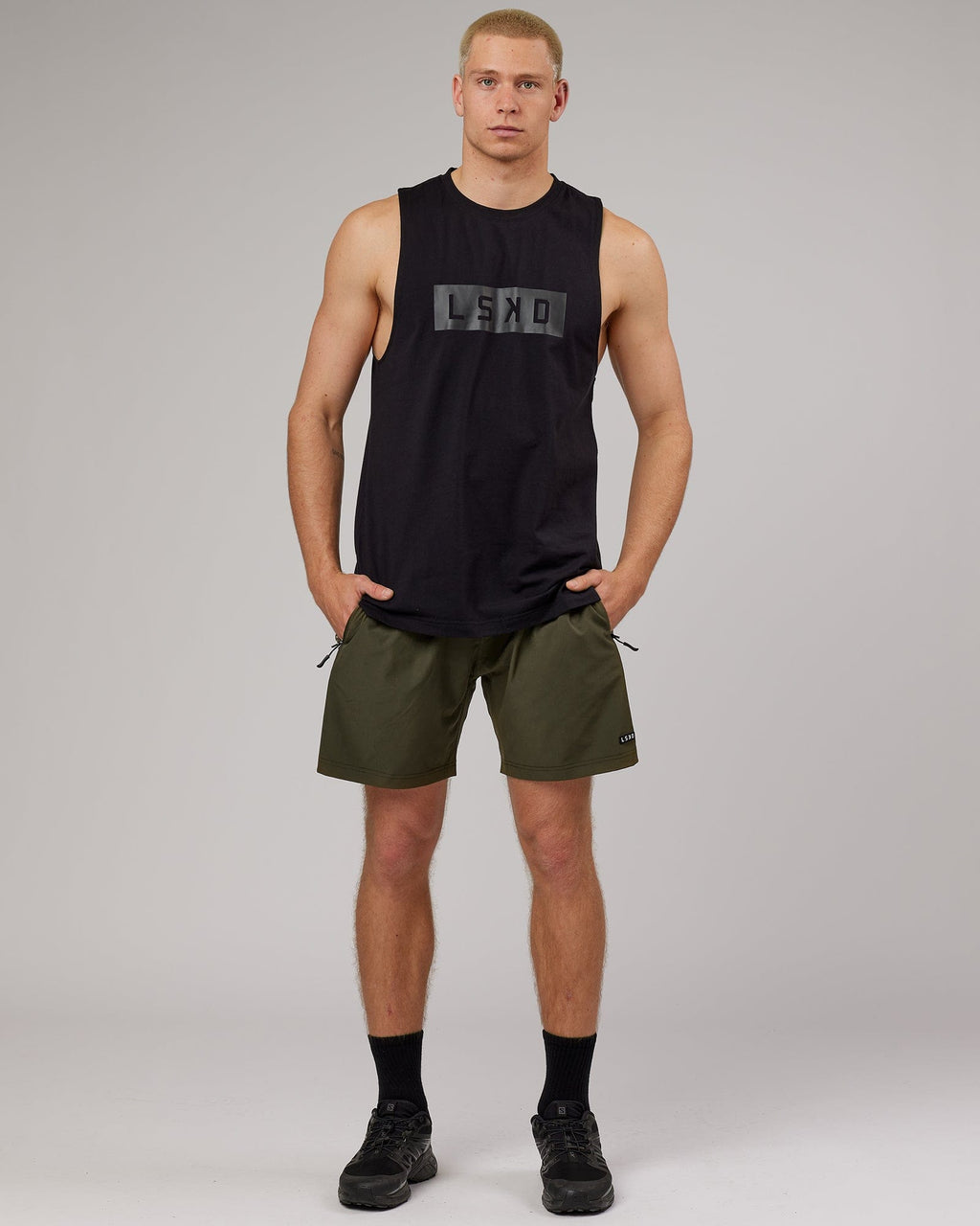 Model wearing Strength FLXDRY Training Fit Performance Tank - Black