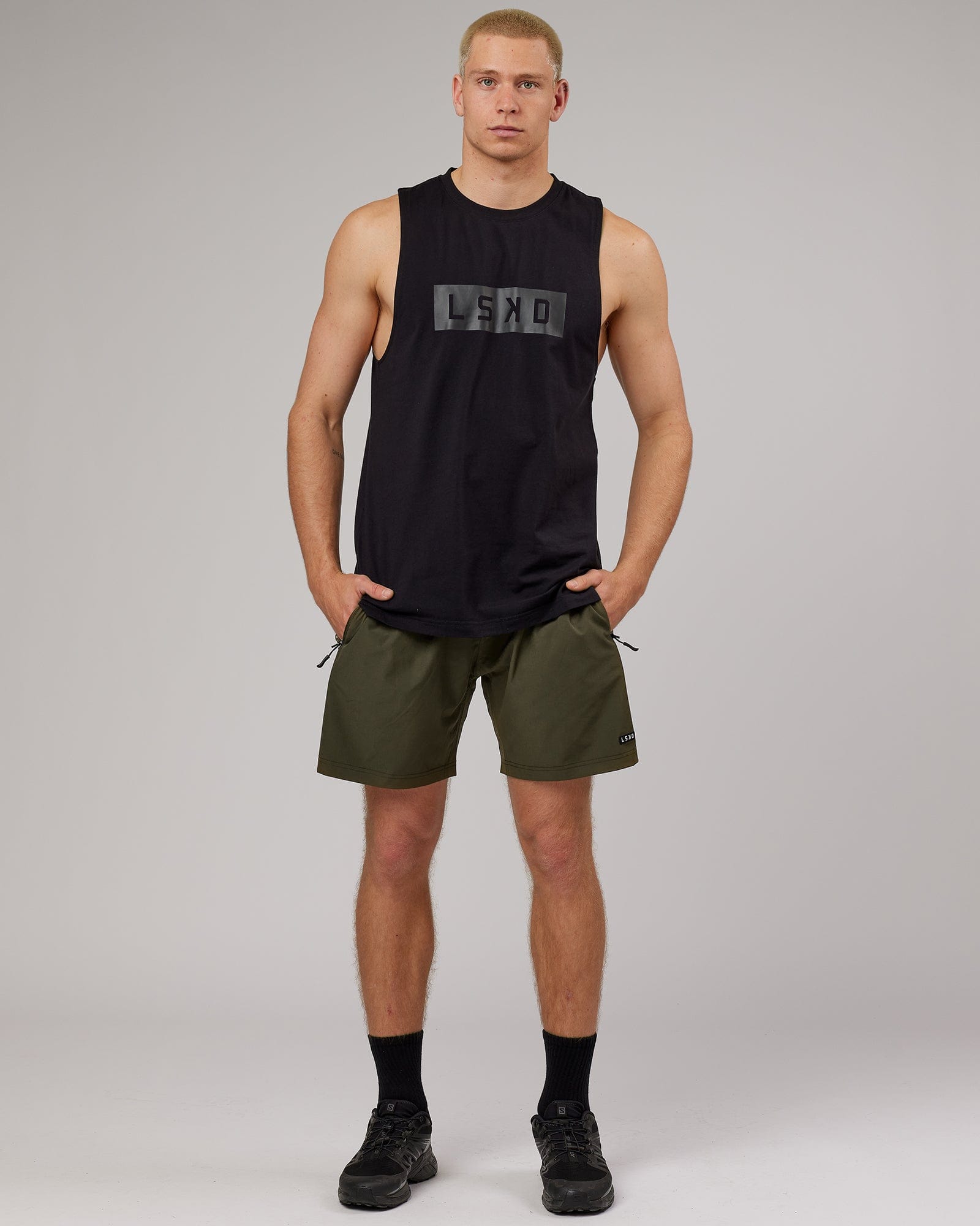Model wearing Strength FLXDRY Training Fit Performance Tank - Black