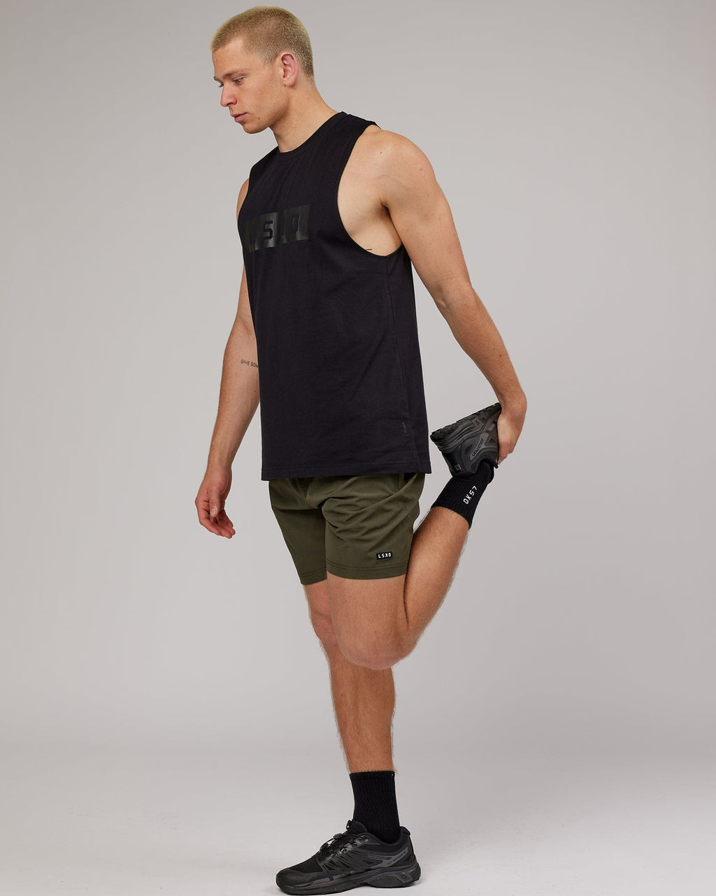 Model wearing Strength FLXDRY Training Fit Performance Tank - Black