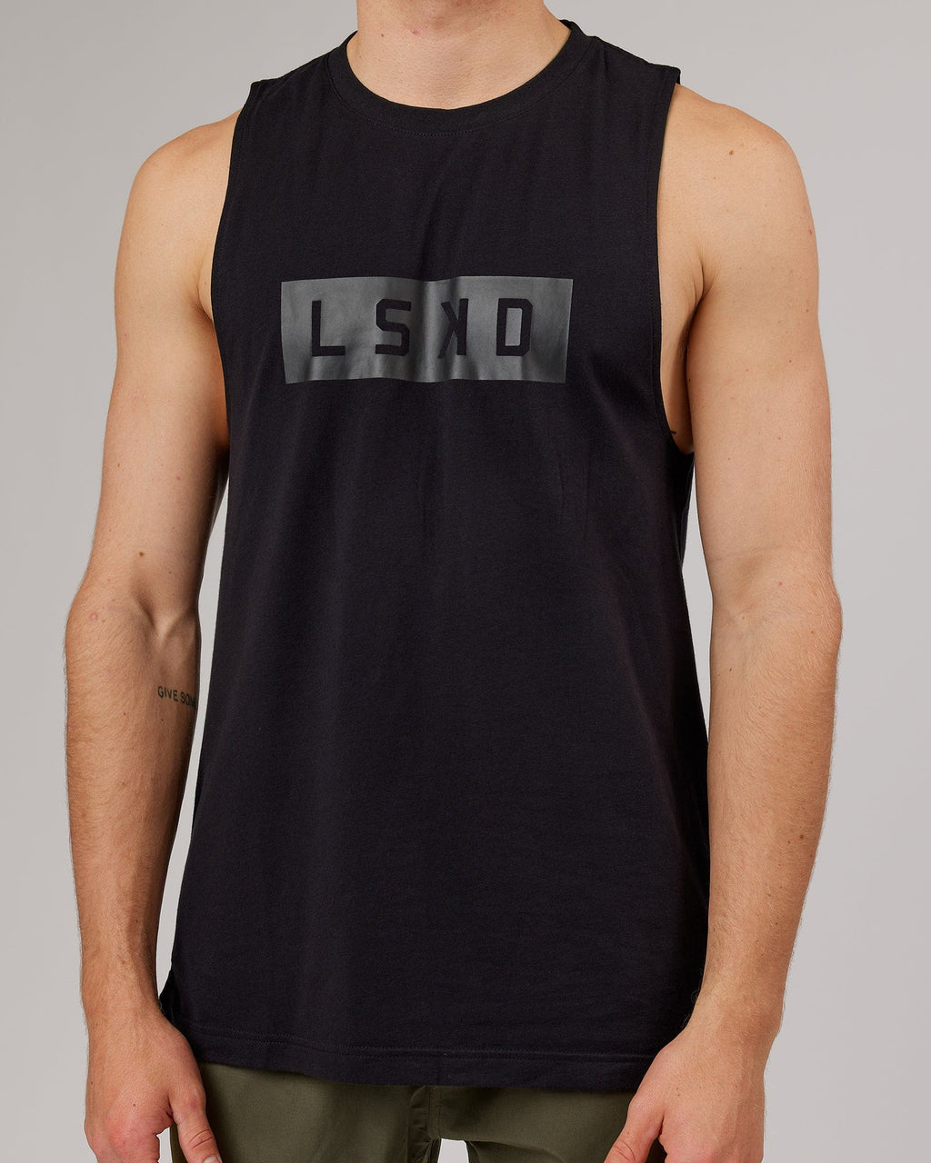 Model wearing Strength FLXDRY Training Fit Performance Tank - Black