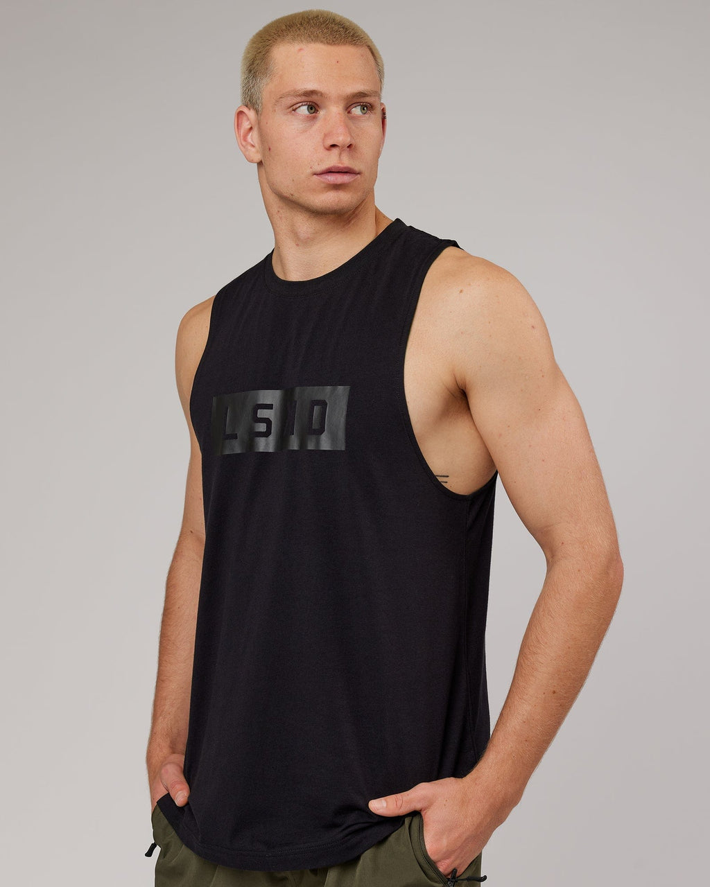 Model wearing Strength FLXDRY Training Fit Performance Tank - Black