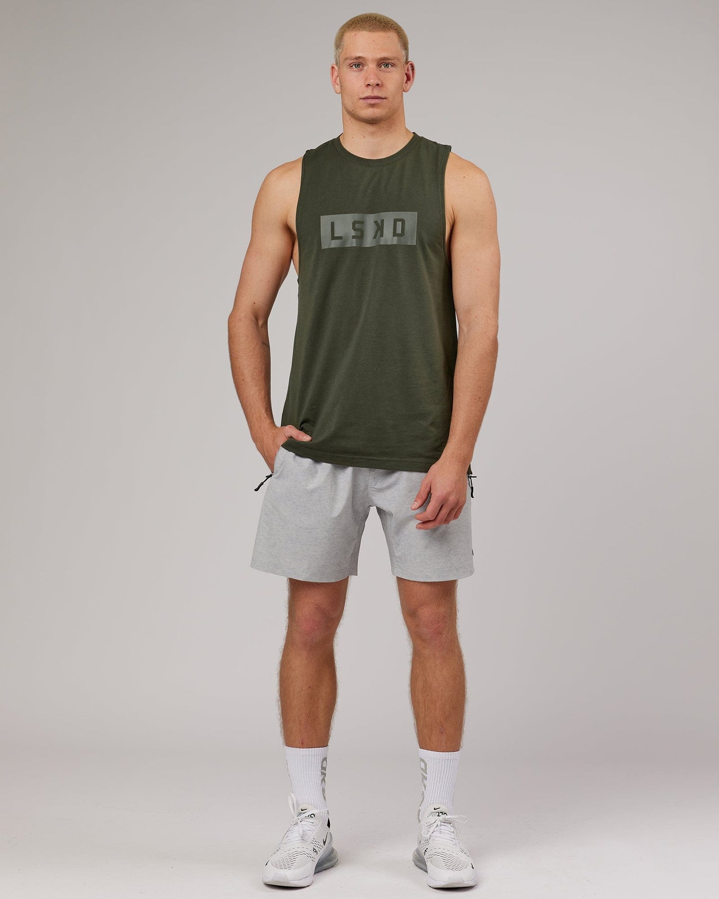 Model wearing Strength FLXDRY Training Fit Performance Tank - Forest Night