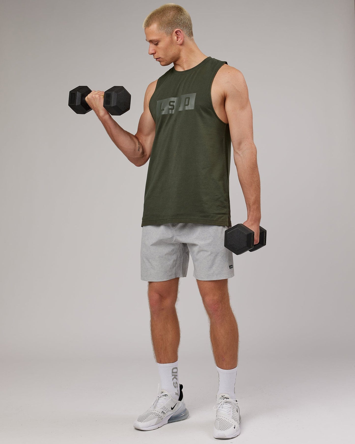 Model wearing Strength FLXDRY Training Fit Performance Tank - Forest Night