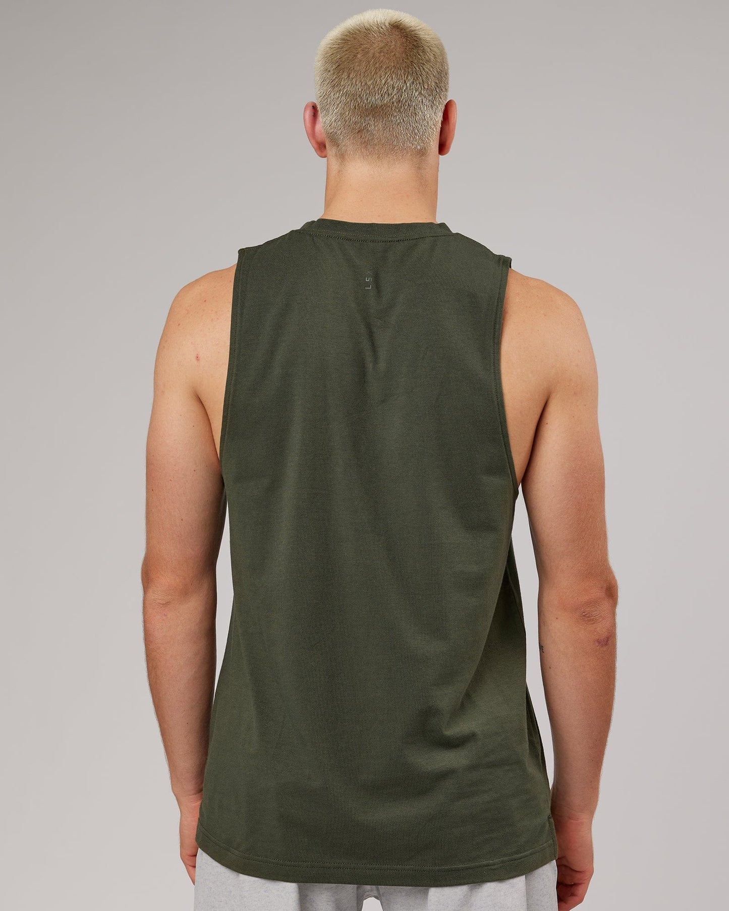 Model wearing Strength FLXDRY Training Fit Performance Tank - Forest Night