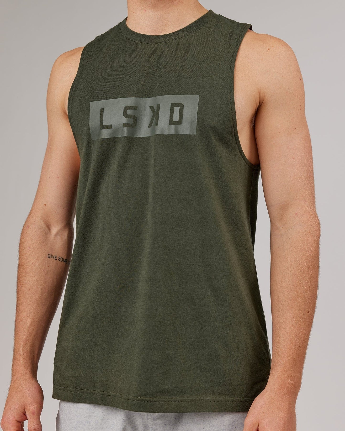 Model wearing Strength FLXDRY Training Fit Performance Tank - Forest Night