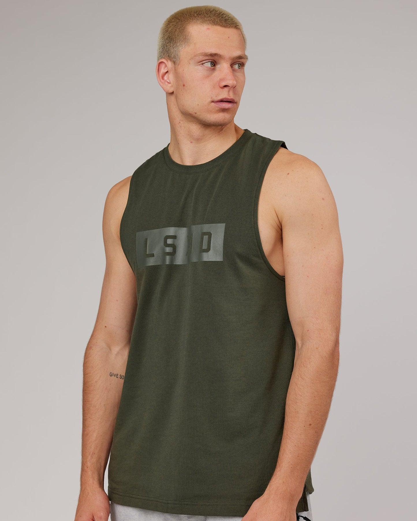 Model wearing Strength FLXDRY Training Fit Performance Tank - Forest Night