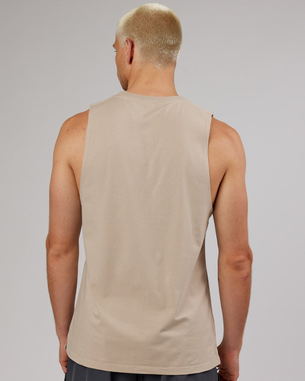 Model wearing Strength FLXDRY Training Fit Performance Tank - Taupe