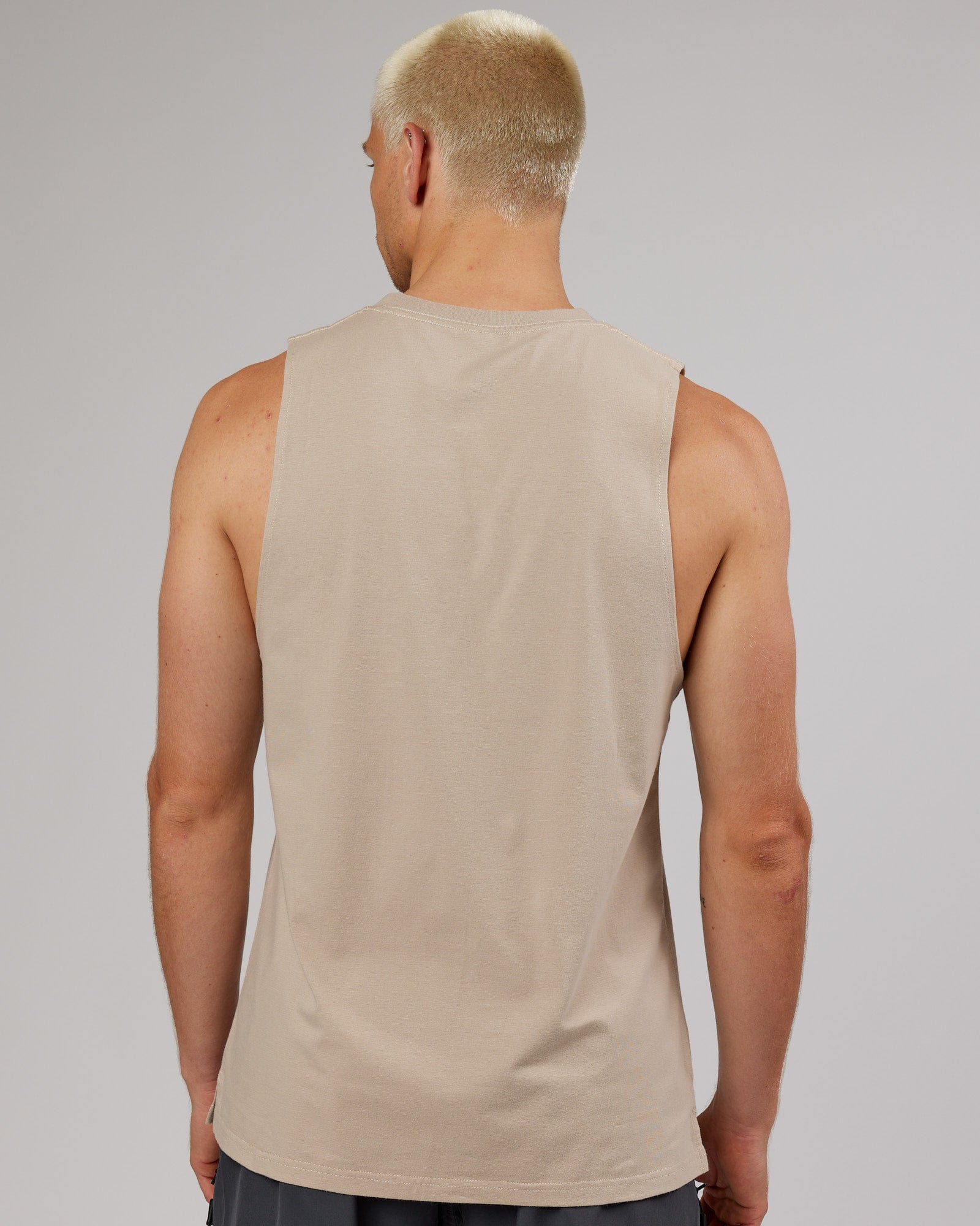 Model wearing Strength FLXDRY Training Fit Performance Tank - Taupe