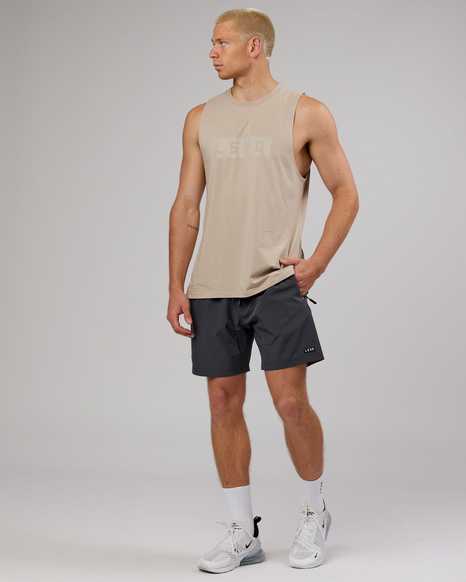 Model wearing Strength FLXDRY Training Fit Performance Tank - Taupe