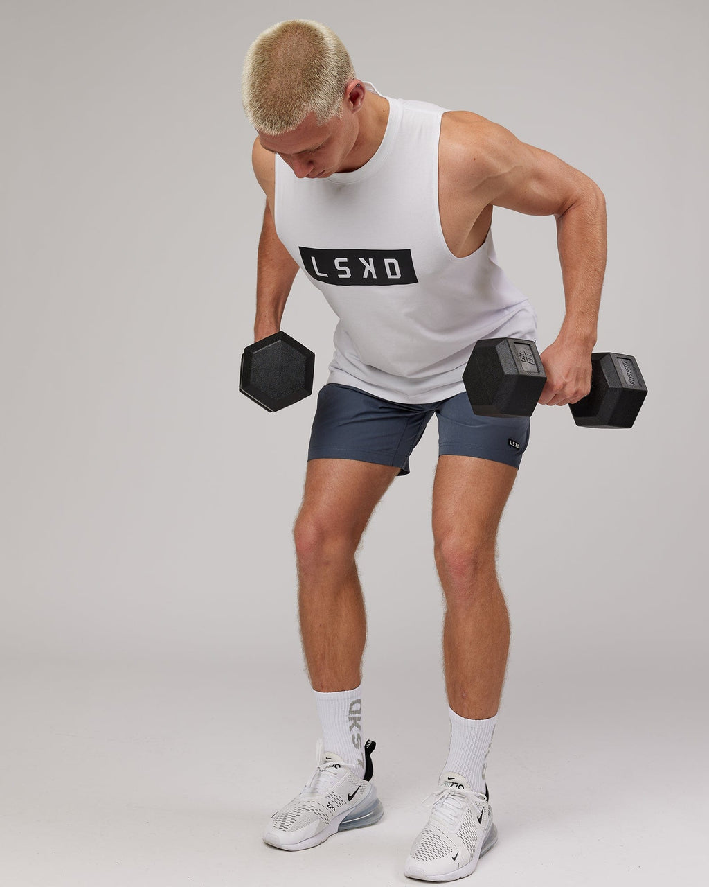 Model wearing Strength FLXDRY Training Fit Performance Tank - White-Black