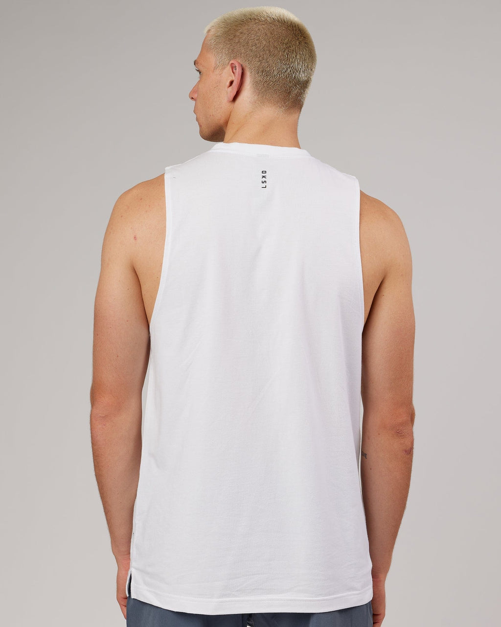 Model wearing Strength FLXDRY Training Fit Performance Tank - White-Black