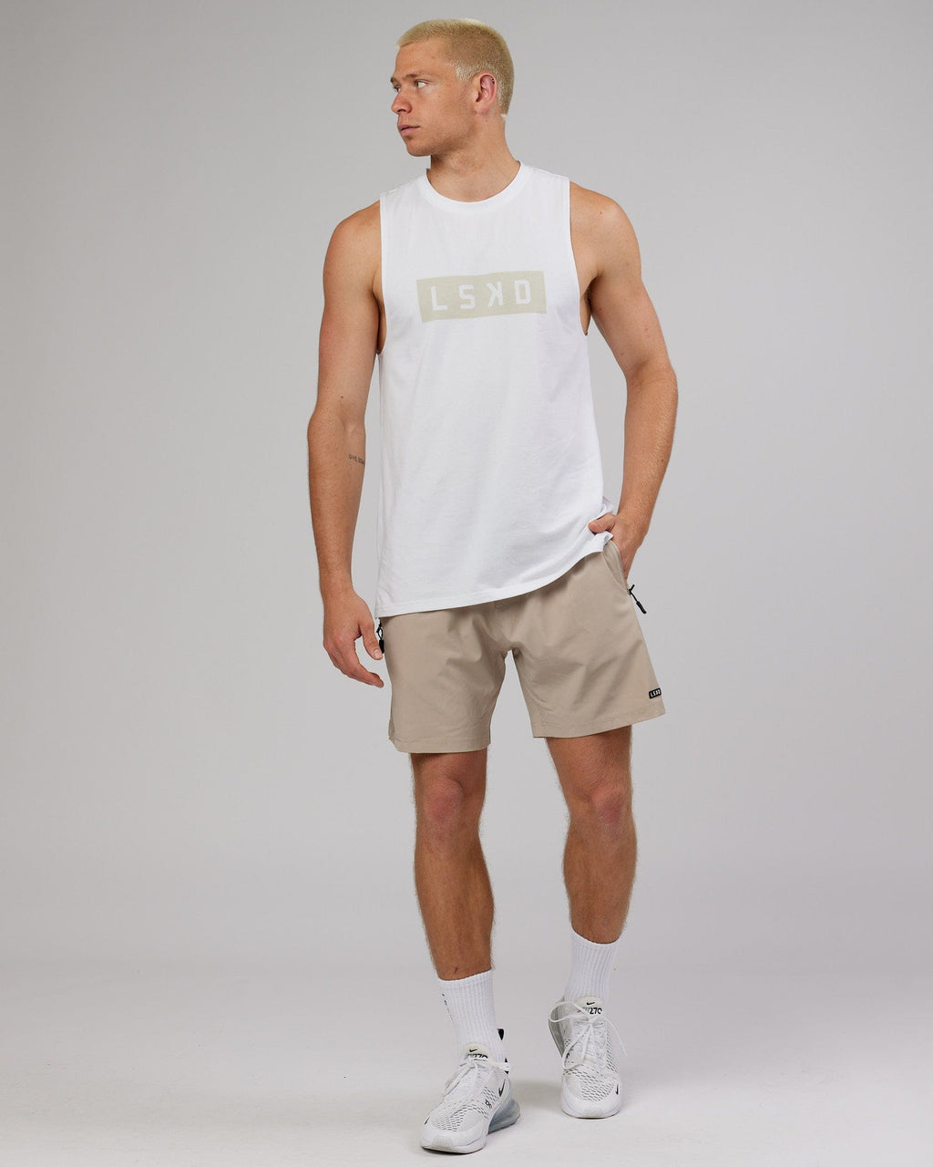 Model wearing Strength FLXDRY Training Fit Performance Tank - White-Taupe