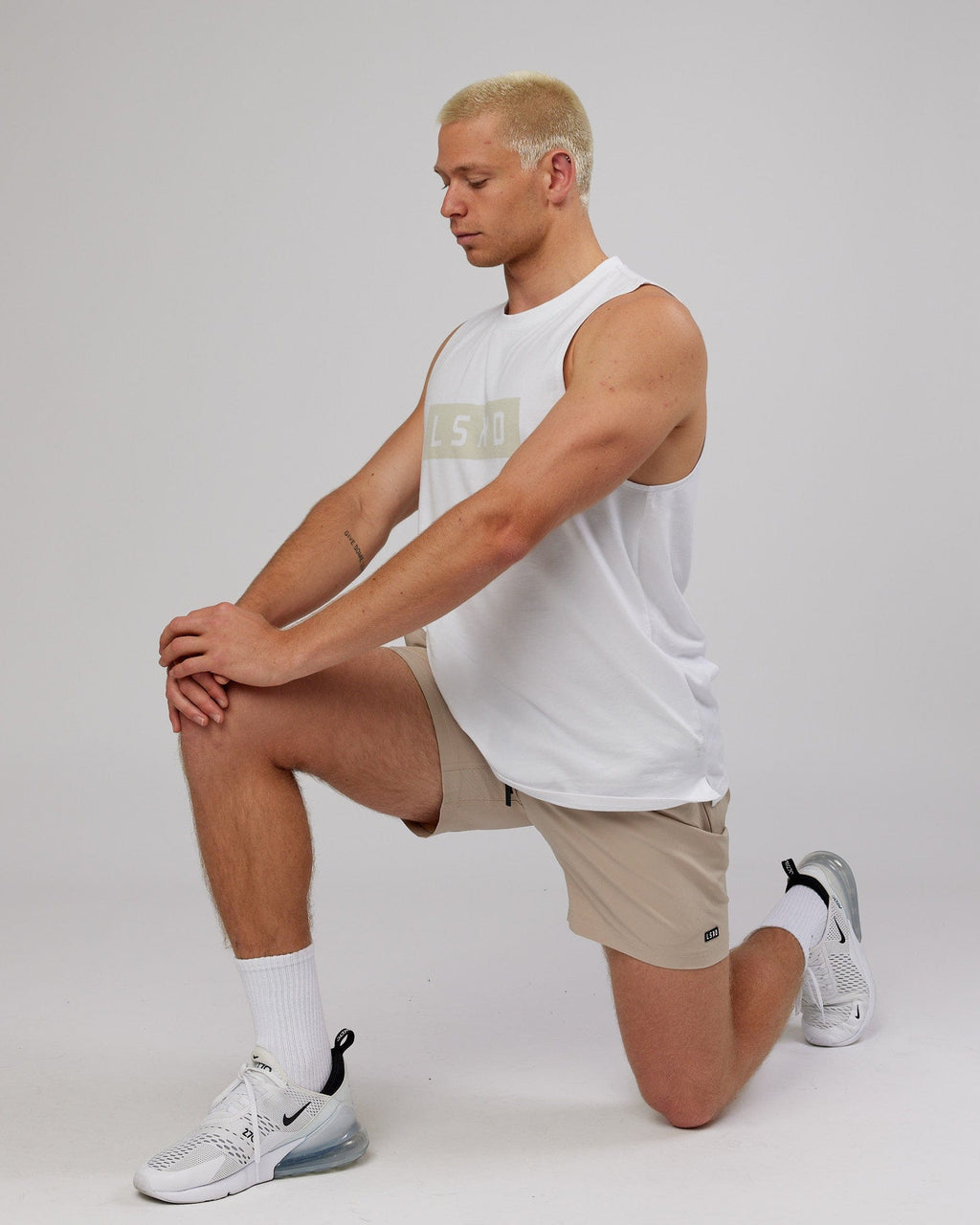 Model wearing Strength FLXDRY Training Fit Performance Tank - White-Taupe