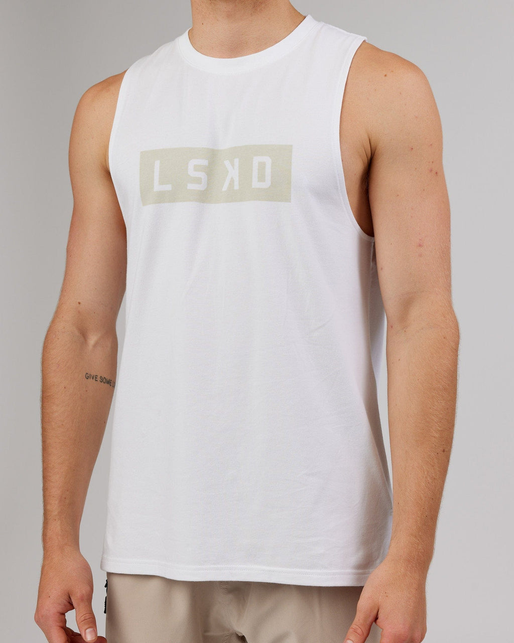 Model wearing Strength FLXDRY Training Fit Performance Tank - White-Taupe