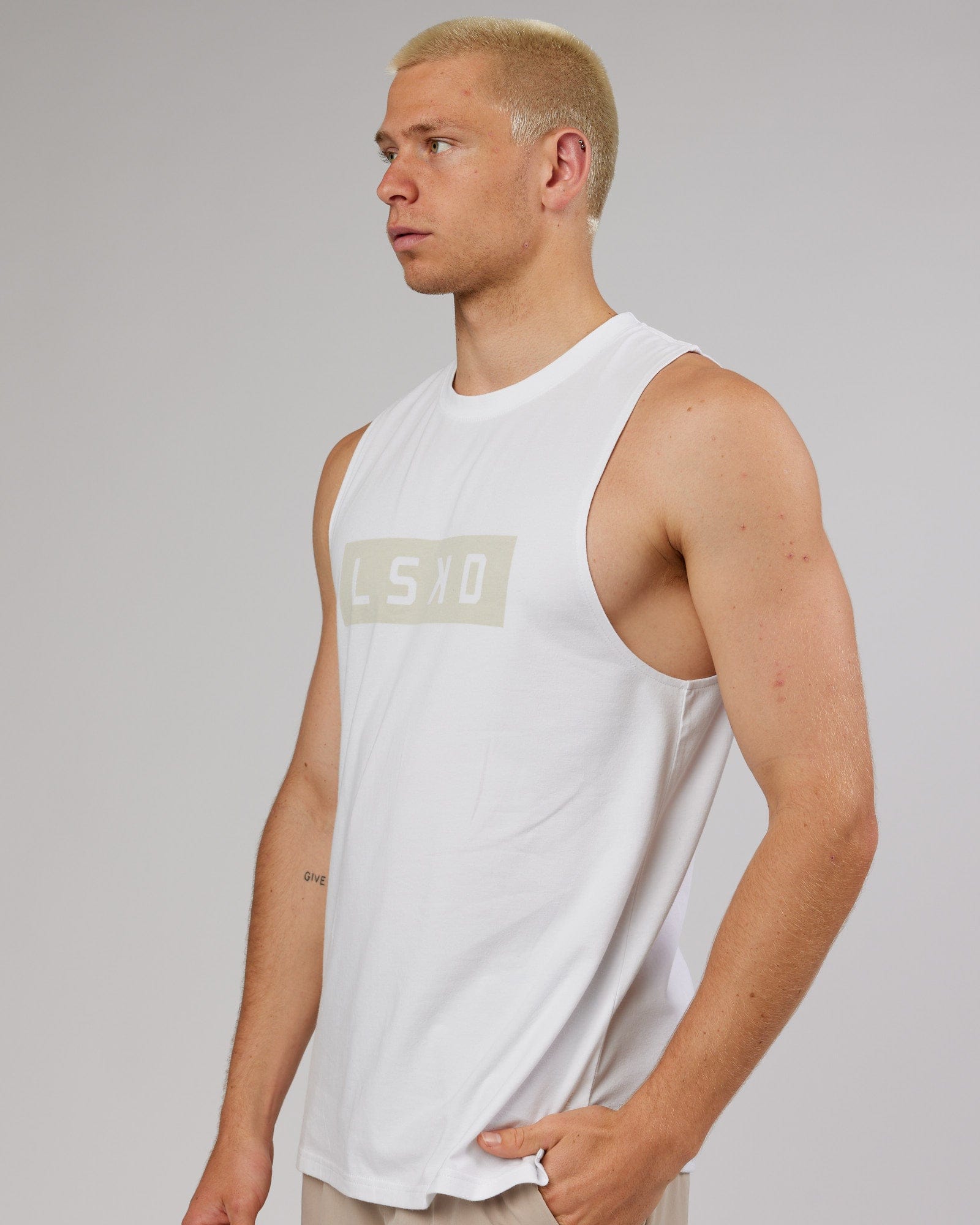 Model wearing Strength FLXDRY Training Fit Performance Tank - White-Taupe