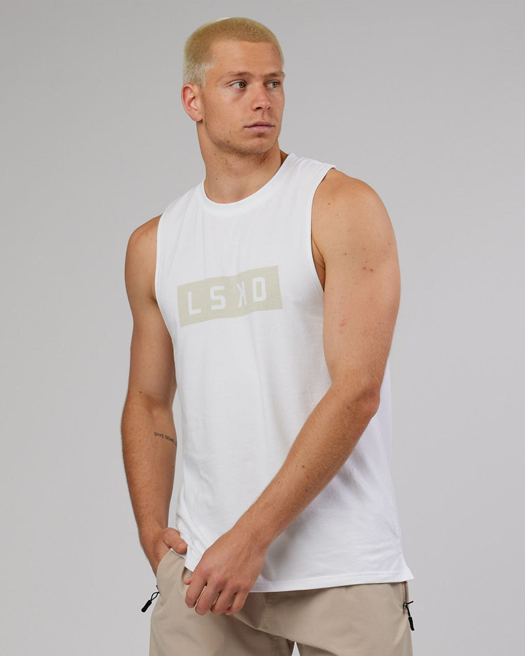Model wearing Strength FLXDRY Training Fit Performance Tank - White-Taupe