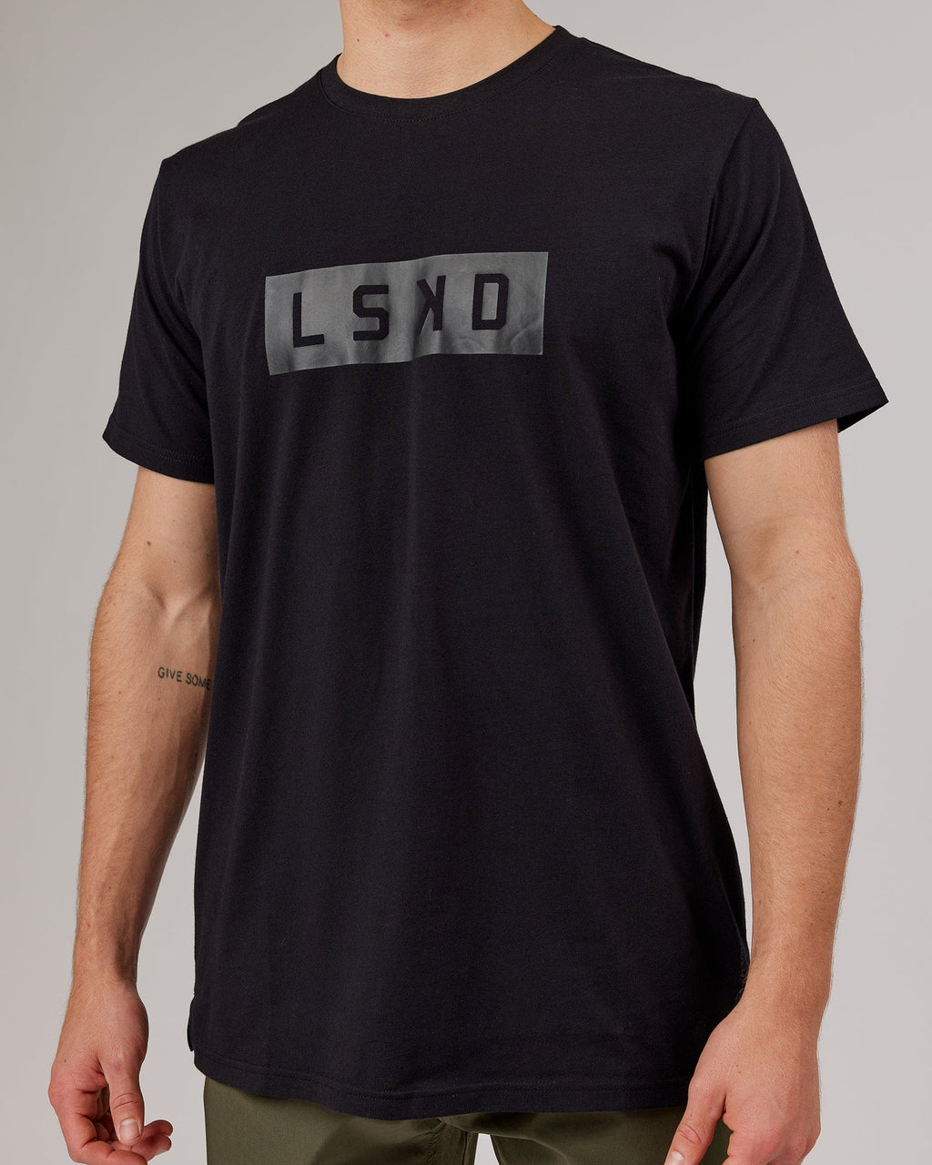 Model wearing Strength FLXDRY Performance Tee - Black-Black