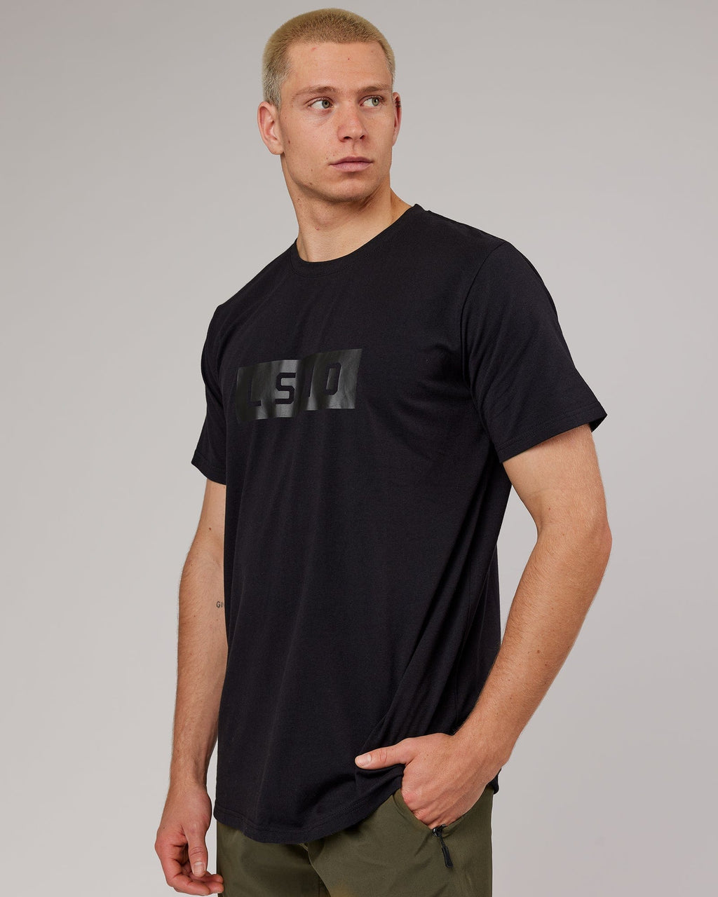 Model wearing Strength FLXDRY Performance Tee - Black-Black