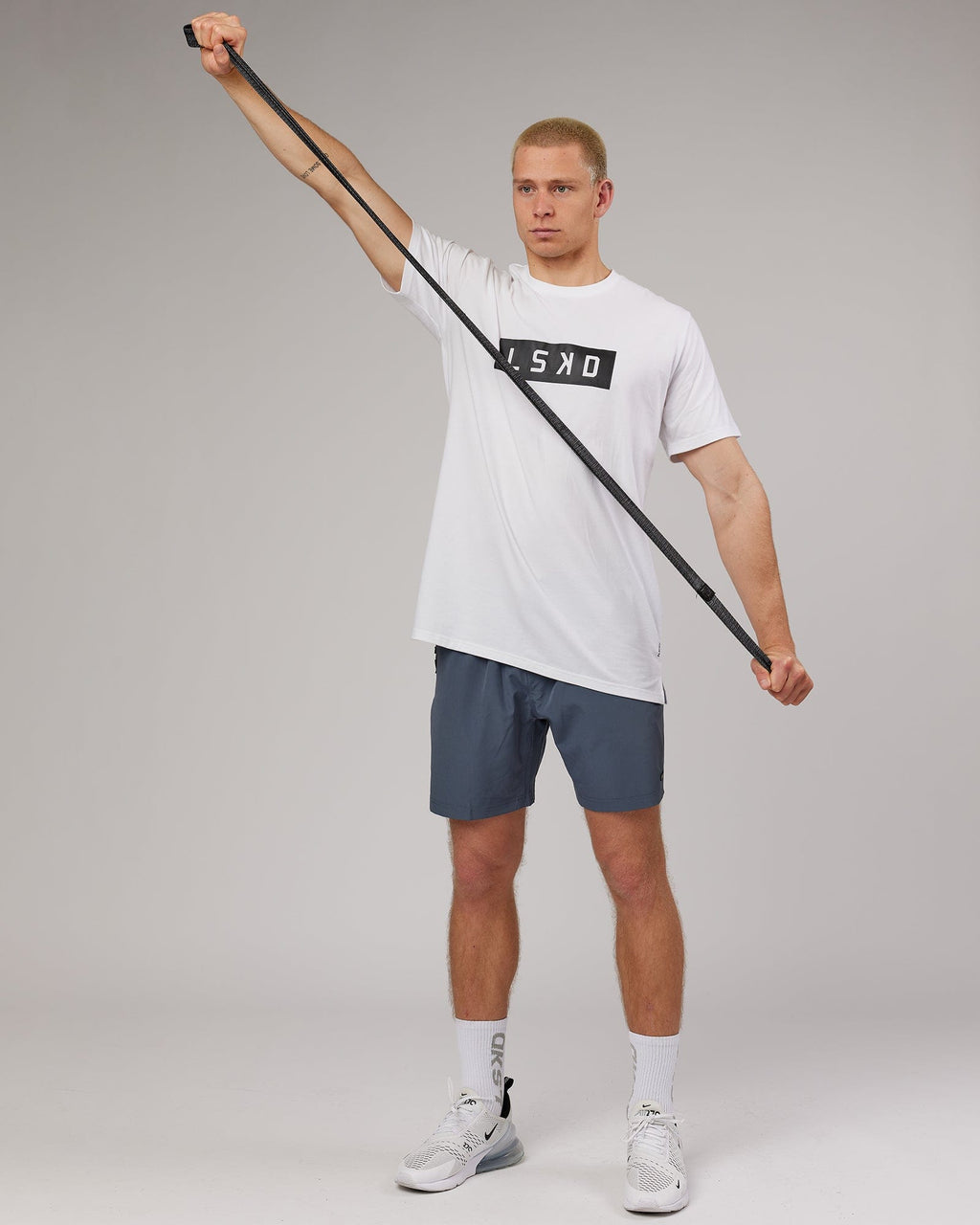 Model wearing Strength FLXDRY Performance Tee - White-Black