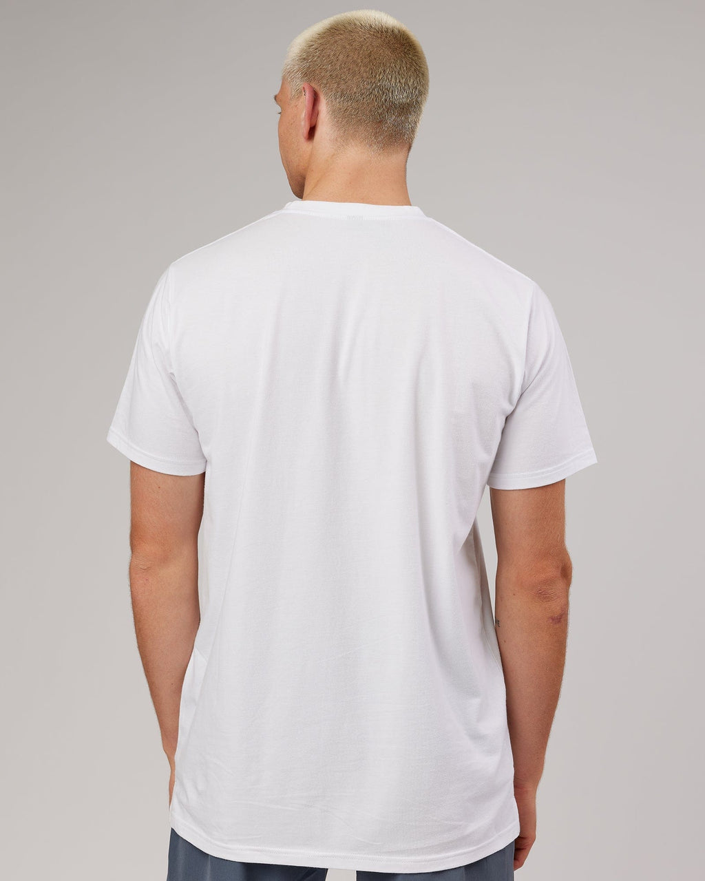 Model wearing Strength FLXDRY Performance Tee - White-Black