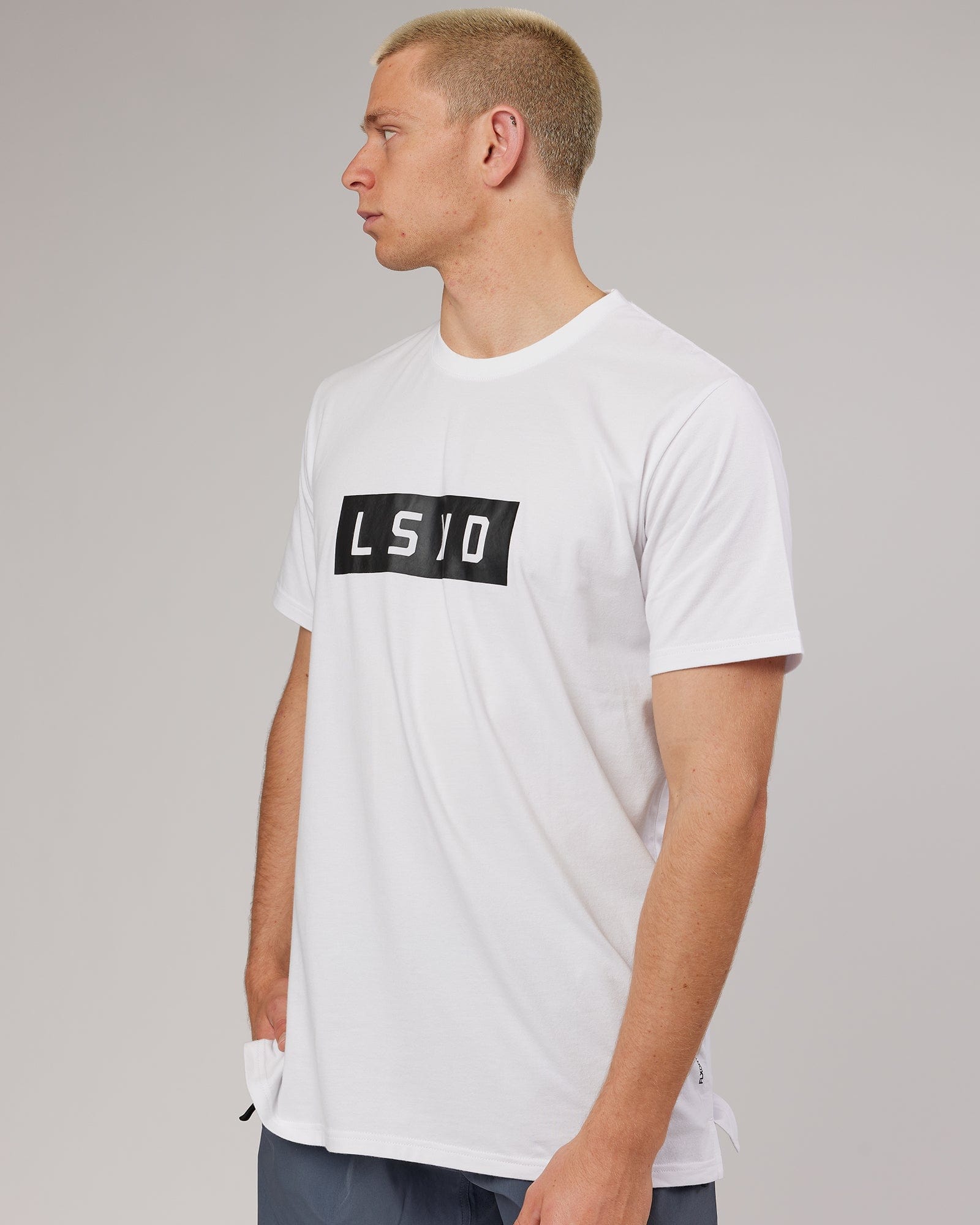 Model wearing Strength FLXDRY Performance Tee - White-Black