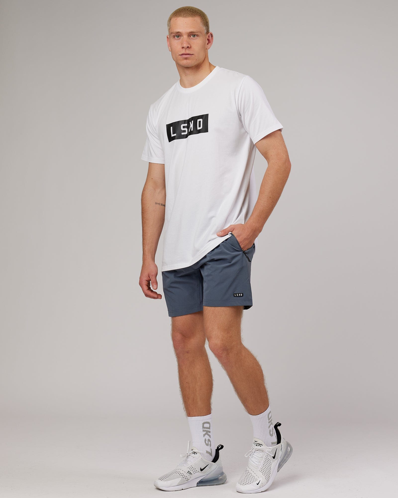 Model wearing Strength FLXDRY Performance Tee - White-Black