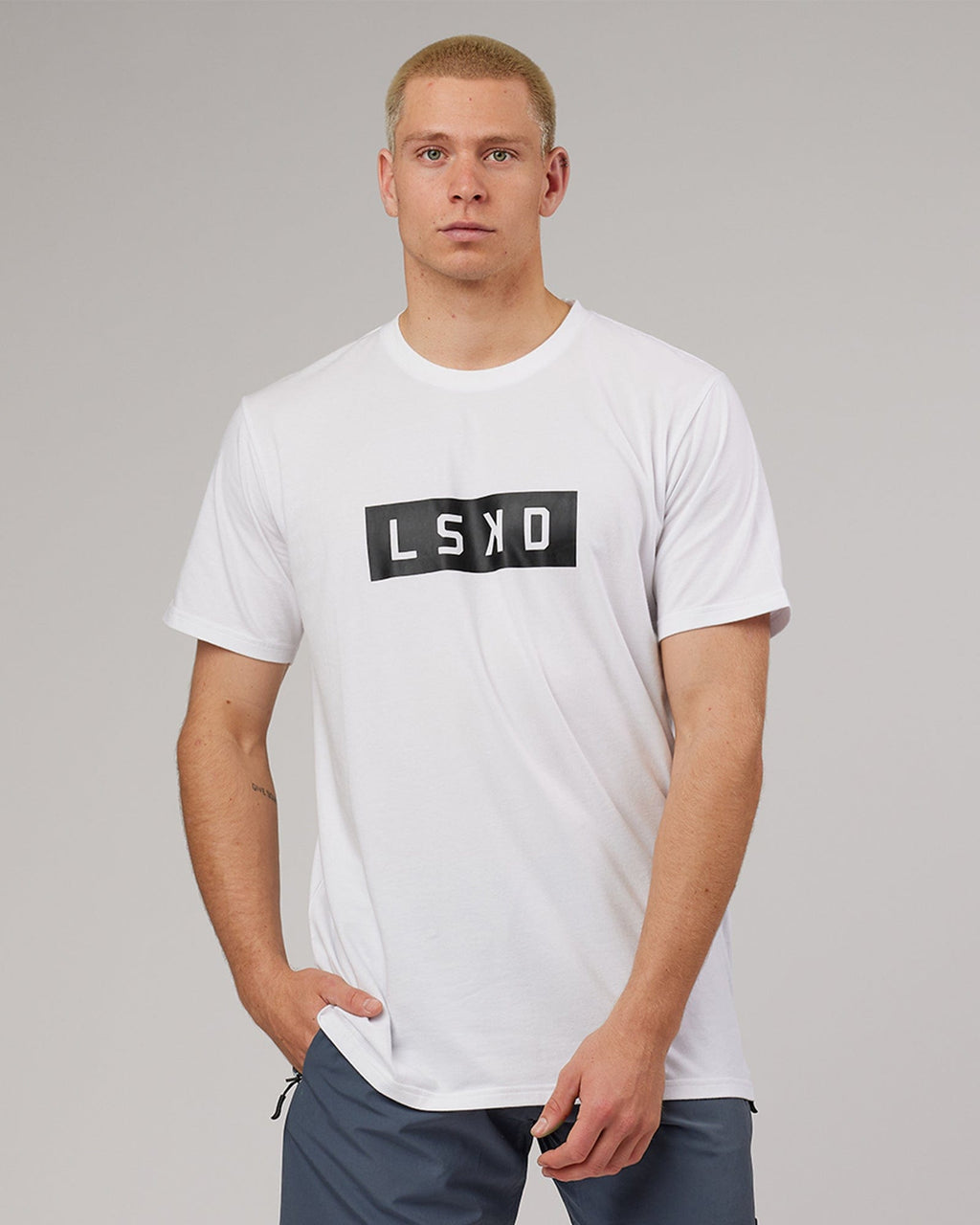 Model wearing Strength FLXDRY Performance Tee - White-Black