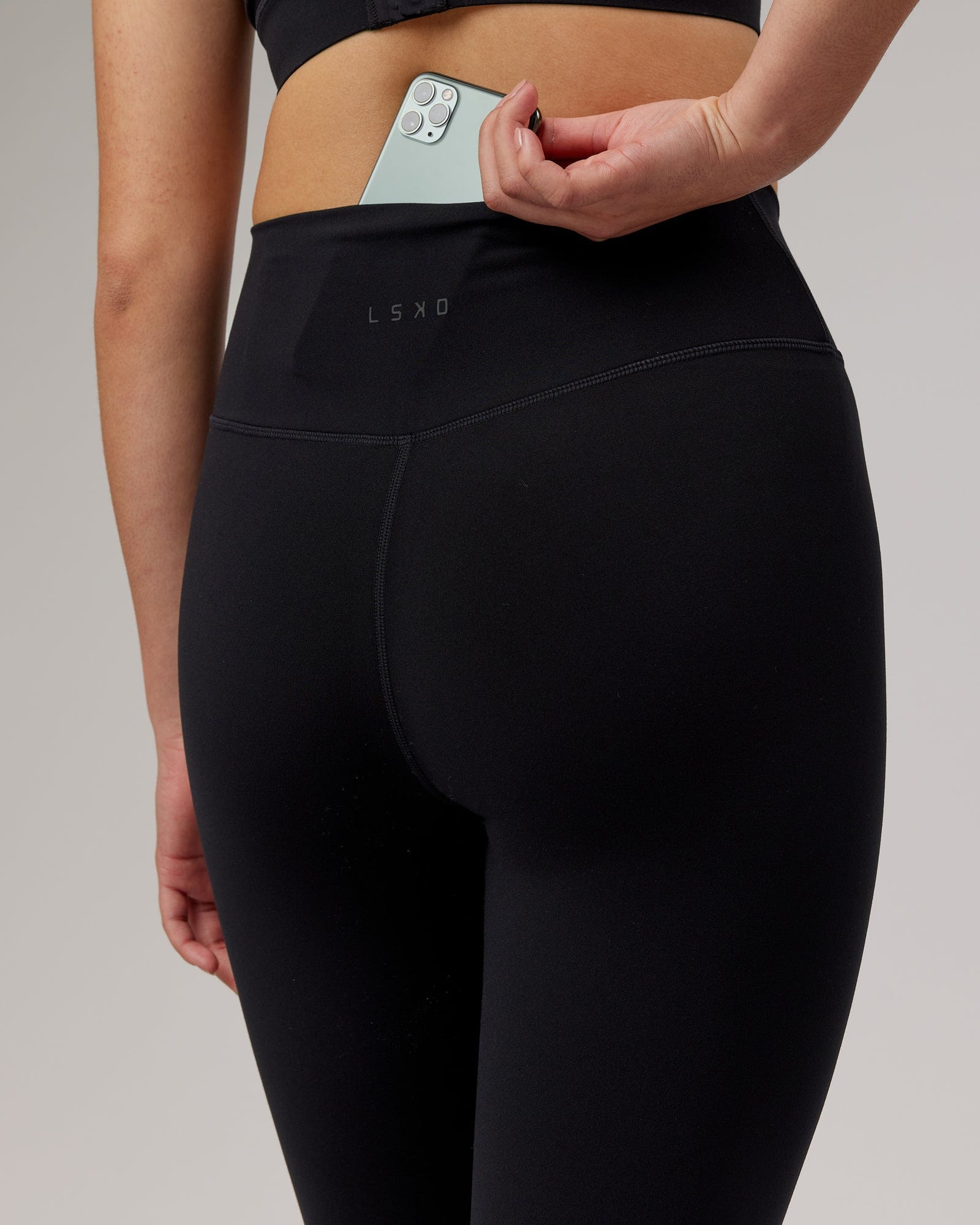 Model wearing Strike 7/8 Length Tight - Black