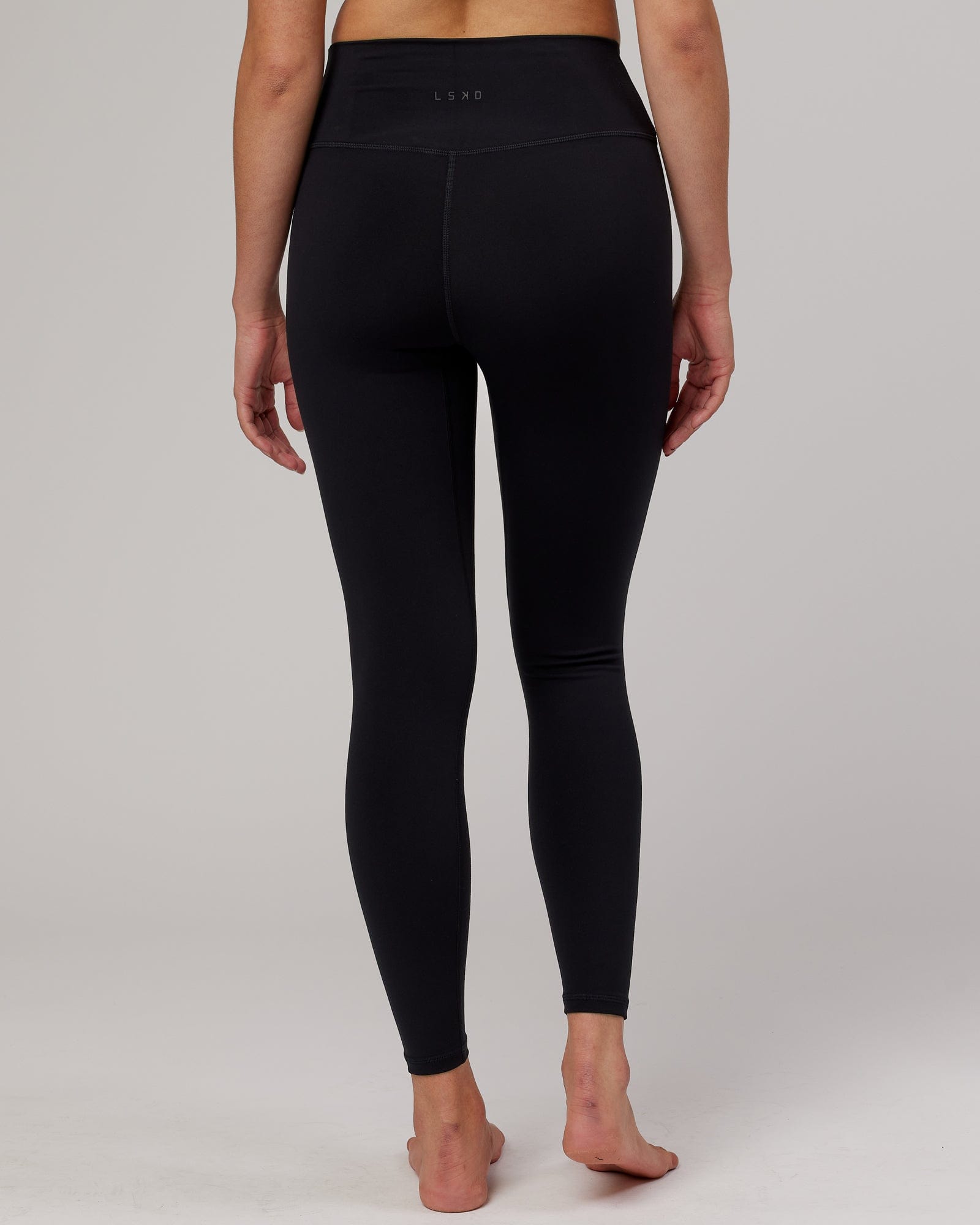 Model wearing Strike Full Length Tight - Black