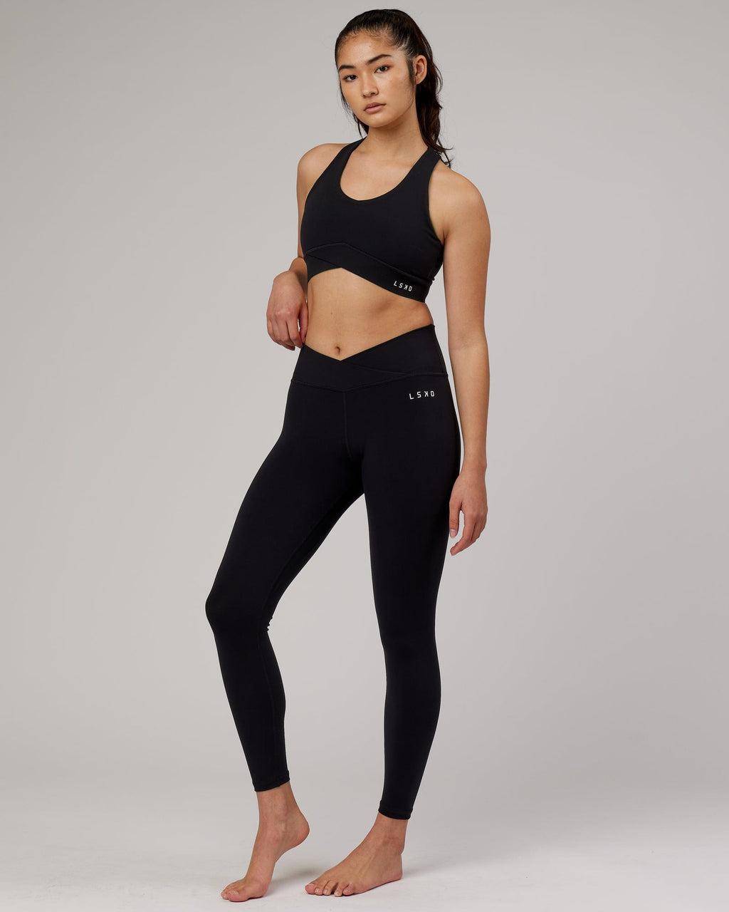 Model wearing Strike Full Length Tight - Black