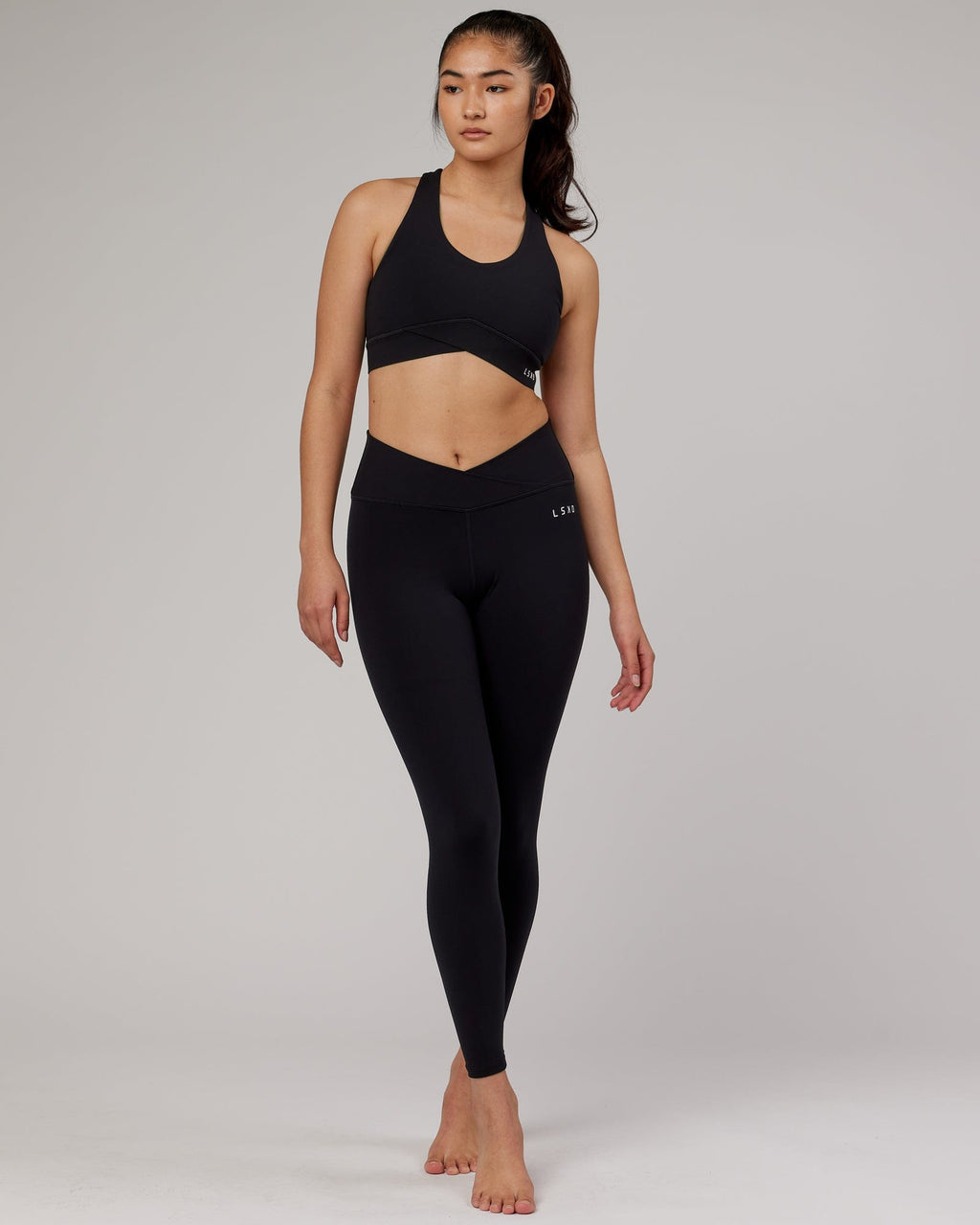 Model wearing Strike Full Length Tight - Black