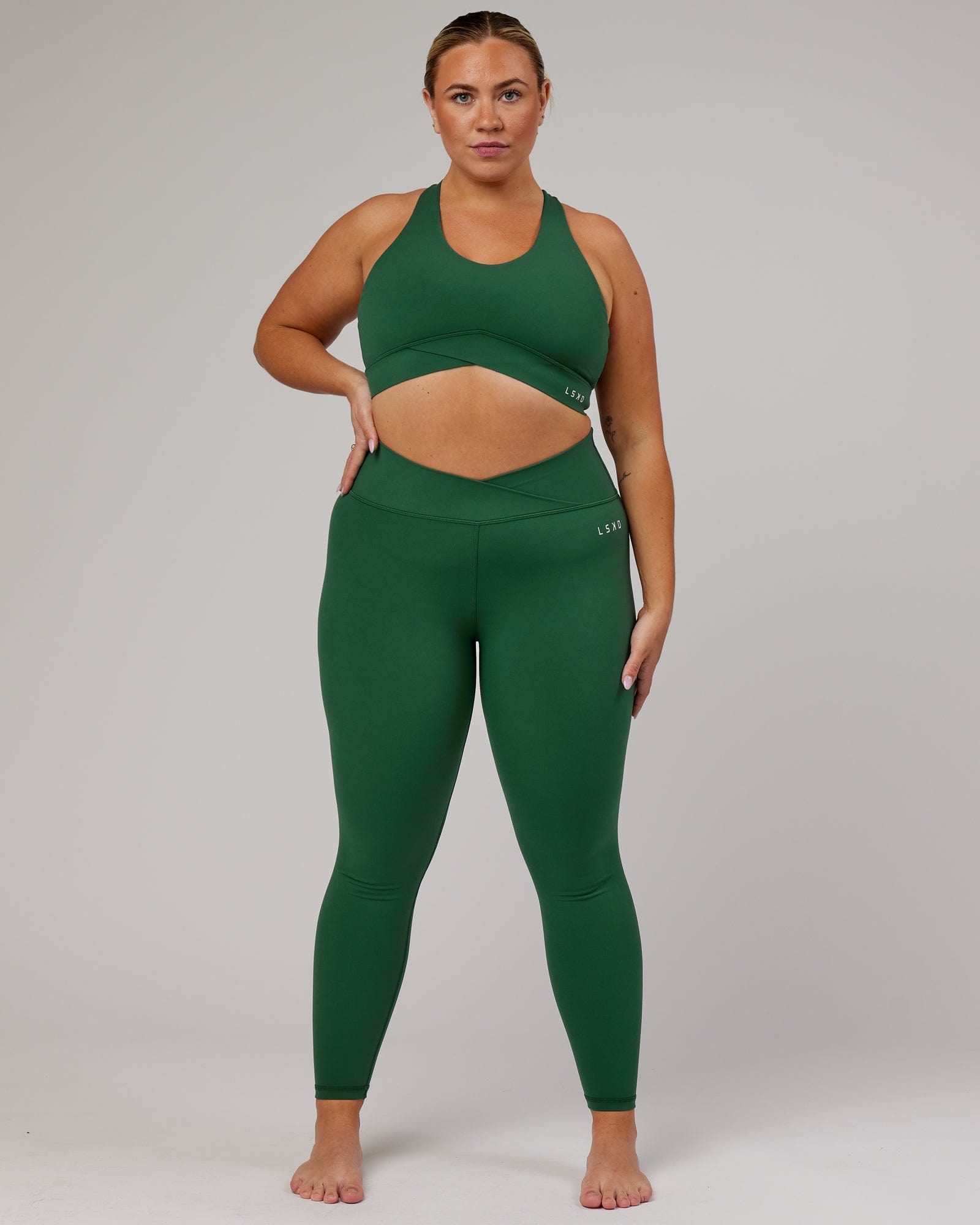 Model wearing Strike Full Length Tight - Pineneedle