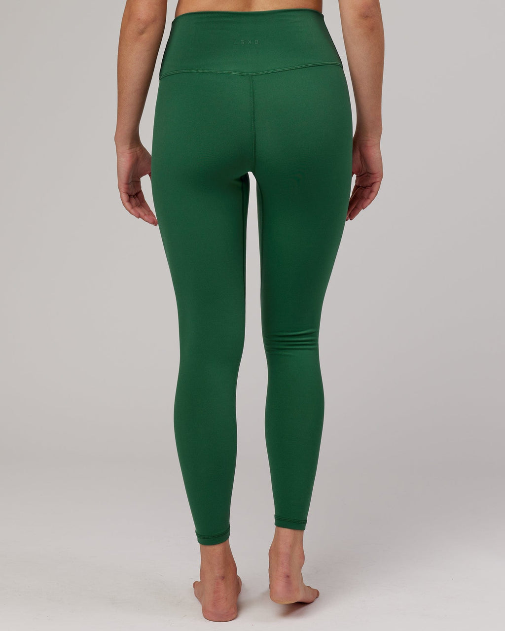 Model wearing Strike Full Length Tight - Pineneedle