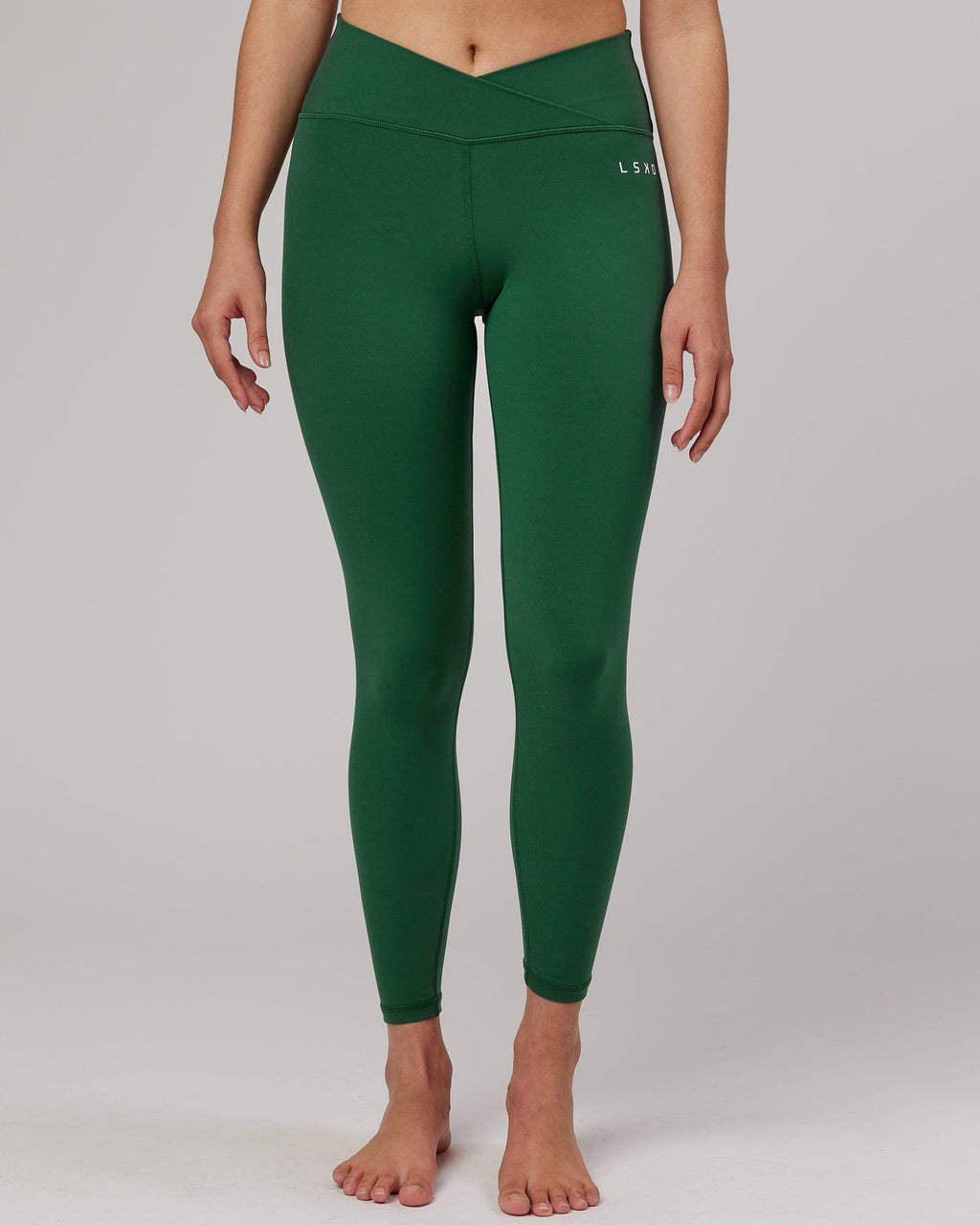 Model wearing Strike Full Length Tight - Pineneedle