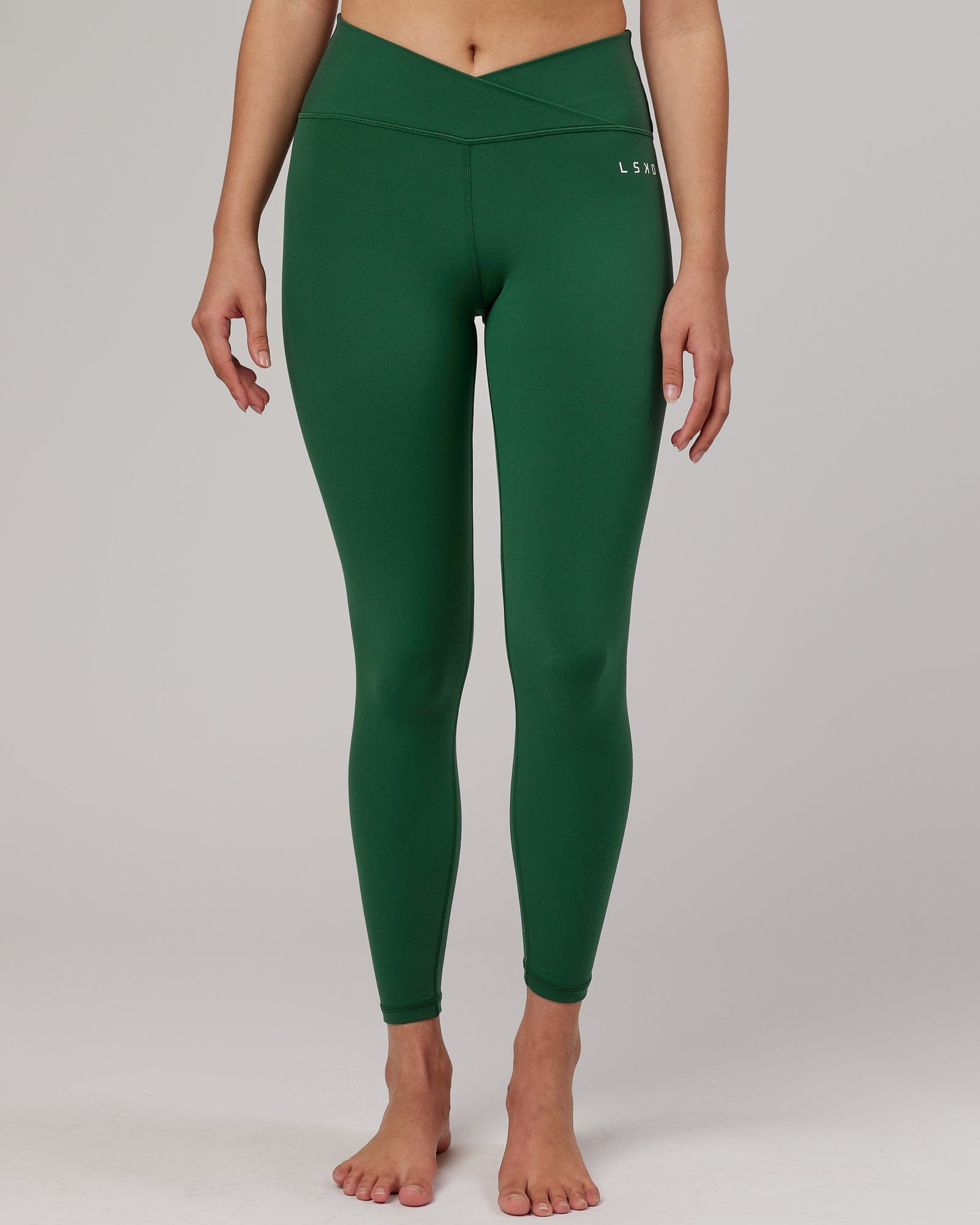 Model wearing Strike Full Length Tight - Pineneedle